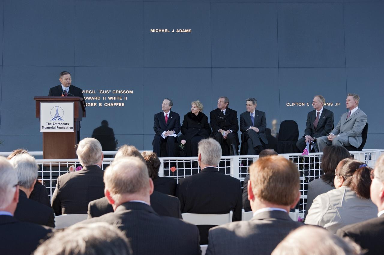 CAPE CANAVERAL, Fla. -- Rick Soria, the 2009 Alan Shepard Technology in Education Award winner, speaks to a crowd gathered in front of the Space Mirror Memorial at the Kennedy Space Center Visitor Complex in Florida to honor space shuttle Challenger's STS-51L crew members who gave their lives for while furthering the cause of exploration and discovery. 2011 marks the 25th anniversary of the loss of Challenger, which broke apart over the Atlantic Ocean 73 seconds into flight on Jan. 28, 1986.               Photo credit: NASA/Kim Shiflett