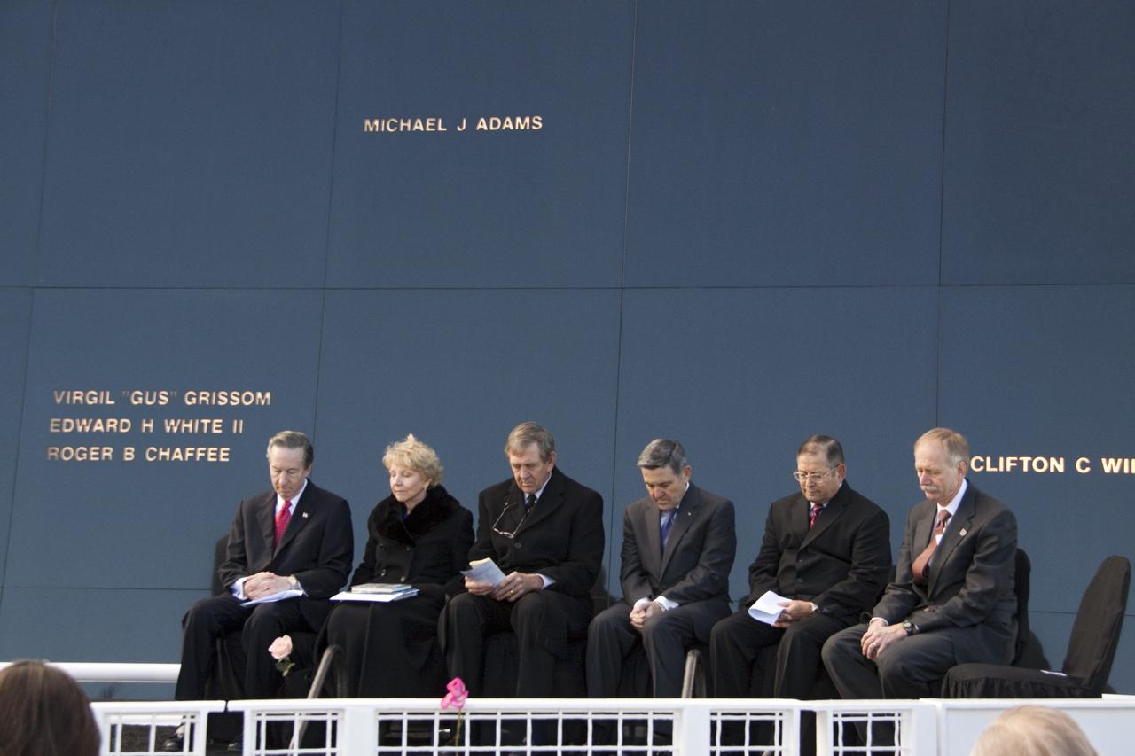 CAPE CANAVERAL, Fla. -- Stephen Feldman, president of the Astronauts Memorial Foundation, left; Dr. June Scobee Rodgers, founding chair of the Challenger Center for Space Science Education and widow of space shuttle Challenger's STS-51L Commander Dick Scobee; Michael McCulley, former astronaut and chairman of the Astronauts Memorial Foundation; Bob Cabana, former astronaut and NASA Kennedy Space Center director; Rick Soria, 2009 Alan Shepard Technology in Education Award winner, and William Gerstenmaier, NASA Associate Administrator for Space Operations gather in front of the Space Mirror Memorial at the Kennedy Space Center Visitor Complex in Florida to honor the Challenger crew members who gave their lives for while furthering the cause of exploration and discovery. 2011 marks the 25th anniversary of the loss of Challenger, which broke apart over the Atlantic Ocean 73 seconds into flight on Jan. 28, 1986.          NASA/Jack Pfaller