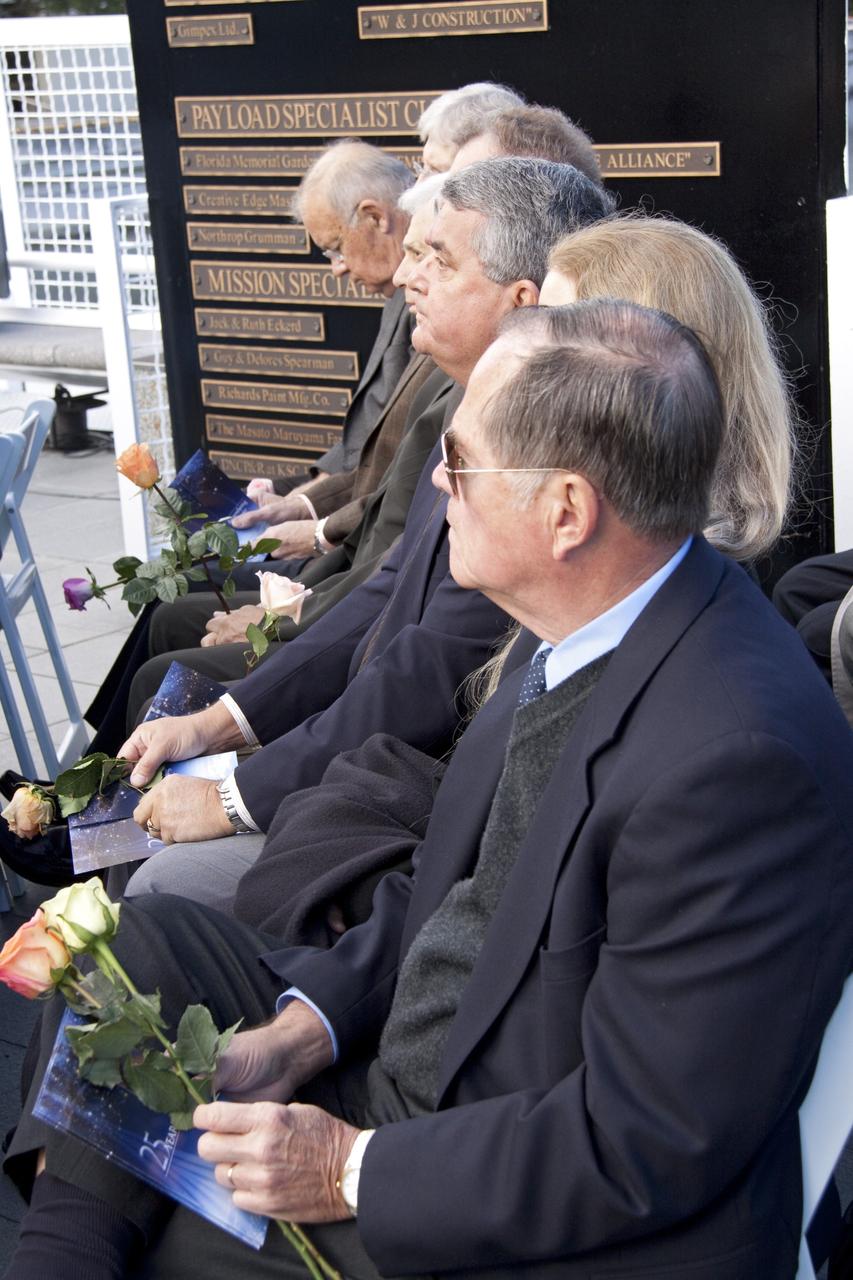 CAPE CANAVERAL, Fla. -- A crowd gathers in front of the Space Mirror Memorial at the Kennedy Space Center Visitor Complex in Florida to honor space shuttle Challenger's STS-51L crew members who gave their lives for while furthering the cause of exploration and discovery. 2011 marks the 25th anniversary of the loss of Challenger, which broke apart over the Atlantic Ocean 73 seconds into flight on Jan. 28, 1986.      NASA/Jack Pfaller