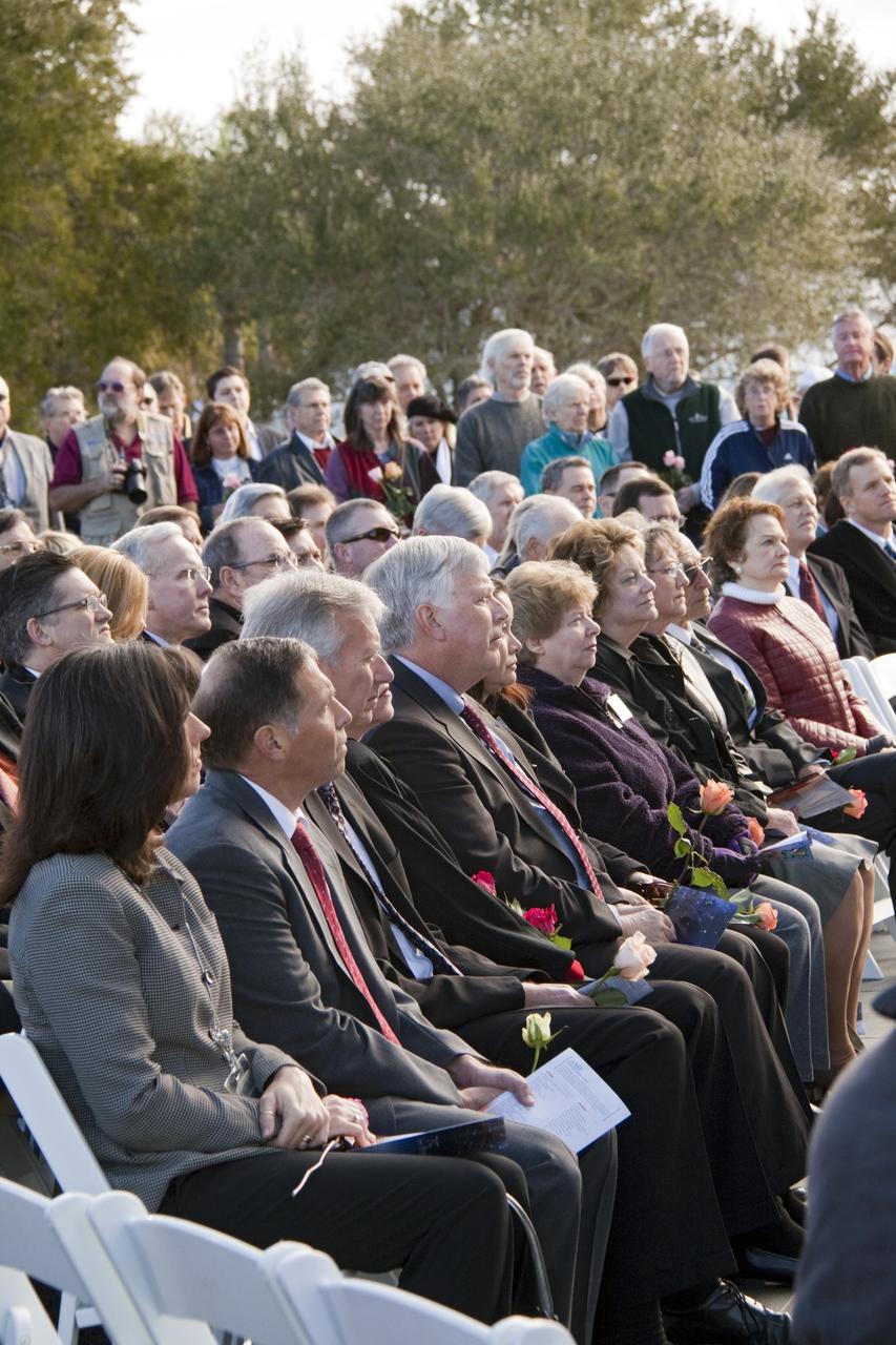 CAPE CANAVERAL, Fla. -- A crowd gathers in front of the Space Mirror Memorial at the Kennedy Space Center Visitor Complex in Florida to honor space shuttle Challenger's STS-51L crew members who gave their lives for while furthering the cause of exploration and discovery. 2011 marks the 25th anniversary of the loss of Challenger, which broke apart over the Atlantic Ocean 73 seconds into flight on Jan. 28, 1986.      NASA/Jack Pfaller