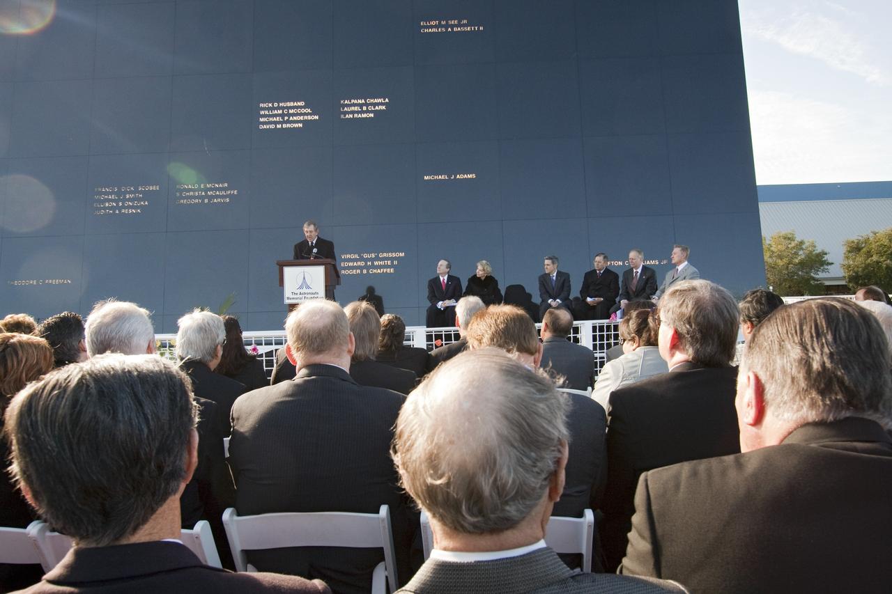 CAPE CANAVERAL, Fla. -- Michael McCulley, former astronaut and chairman of the Astronauts Memorial Foundation, speaks to a crowd gathered in front of the Space Mirror Memorial at the Kennedy Space Center Visitor Complex in Florida to honor space shuttle Challenger's STS-51L crew members who gave their lives for while furthering the cause of exploration and discovery. 2011 marks the 25th anniversary of the loss of Challenger, which broke apart over the Atlantic Ocean 73 seconds into flight on Jan. 28, 1986.          NASA/Jack Pfaller