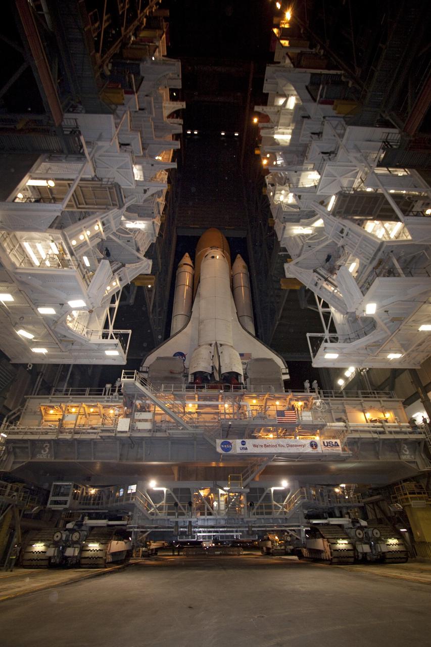 CAPE CANAVERAL, Fla. -- At NASA's Kennedy Space Center in Florida, space shuttle Discovery begins its nighttime trek, known as "rollout," from the Vehicle Assembly Building to Launch Pad 39A. It will take the shuttle, attached to its external fuel tank, twin solid rocket boosters and mobile launcher platform, about seven hours to complete the move atop a crawler-transporter. This is the second time Discovery has rolled out to the pad for the STS-133 mission, and comes after a thorough check and modifications to the shuttle's external tank. Targeted to liftoff Feb. 24, Discovery will take the Permanent Multipurpose Module (PMM) packed with supplies and critical spare parts, as well as Robonaut 2 (R2) to the International Space Station. For more information on STS-133, visit www.nasa.gov/mission_pages/shuttle/shuttlemissions/sts133/. Photo credit: NASA/Jack Pfaller