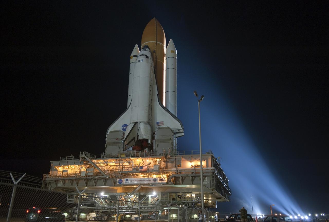 CAPE CANAVERAL, Fla. -- Xenon lights illuminate space shuttle Discovery as it makes its nighttime trek, known as "rollout," from the Vehicle Assembly Building to Launch Pad 39A at NASA's Kennedy Space Center in Florida. It will take the shuttle, attached to its external fuel tank, twin solid rocket boosters and mobile launcher platform, about seven hours to complete the move atop a crawler-transporter. This is the second time Discovery has rolled out to the pad for the STS-133 mission, and comes after a thorough check and modifications to the shuttle's external tank. Targeted to liftoff Feb. 24, Discovery will take the Permanent Multipurpose Module (PMM) packed with supplies and critical spare parts, as well as Robonaut 2 (R2) to the International Space Station. For more information on STS-133, visit www.nasa.gov/mission_pages/shuttle/shuttlemissions/sts133/. Photo credit: NASA/Kim Shiflett