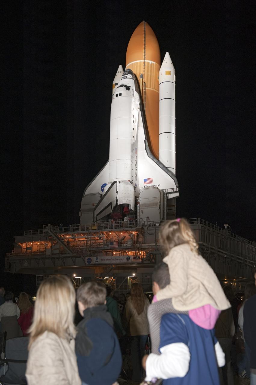 CAPE CANAVERAL, Fla. -- Outside the Vehicle Assembly Building at NASA's Kennedy Space Center in Florida, Kennedy employees, and their families and friends, are on hand to watch space shuttle Discovery roll out to Launch Pad 39A. It will take the shuttle, attached to its external fuel tank, twin solid rocket boosters and mobile launcher platform, about seven hours to complete the move atop a crawler-transporter. This is the second time Discovery has rolled out to the pad for the STS-133 mission, and comes after a thorough check and modifications to the shuttle's external tank. Targeted to liftoff Feb. 24, Discovery will take the Permanent Multipurpose Module (PMM) packed with supplies and critical spare parts, as well as Robonaut 2 (R2) to the International Space Station. For more information on STS-133, visit www.nasa.gov/mission_pages/shuttle/shuttlemissions/sts133/. Photo credit: NASA/Kim Shiflett