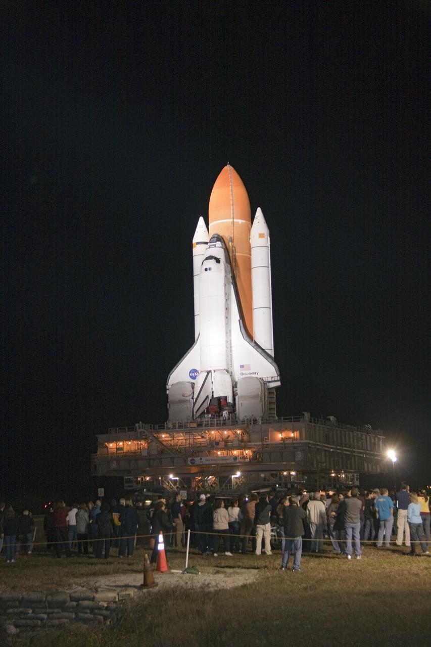 CAPE CANAVERAL, Fla. -- Outside the Vehicle Assembly Building at NASA's Kennedy Space Center in Florida, Kennedy employees, and their families and friends, are on hand to watch space shuttle Discovery roll out to Launch Pad 39A. It will take the shuttle, attached to its external fuel tank, twin solid rocket boosters and mobile launcher platform, about seven hours to complete the move atop a crawler-transporter. This is the second time Discovery has rolled out to the pad for the STS-133 mission, and comes after a thorough check and modifications to the shuttle's external tank. Targeted to liftoff Feb. 24, Discovery will take the Permanent Multipurpose Module (PMM) packed with supplies and critical spare parts, as well as Robonaut 2 (R2) to the International Space Station. For more information on STS-133, visit www.nasa.gov/mission_pages/shuttle/shuttlemissions/sts133/. Photo credit: NASA/Jack Pfaller