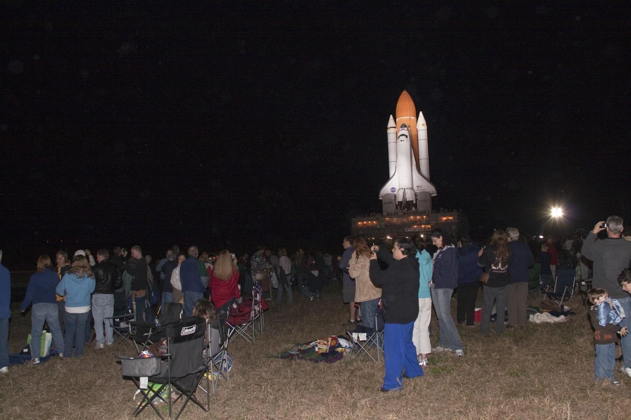CAPE CANAVERAL, Fla. -- Outside the Vehicle Assembly Building at NASA's Kennedy Space Center in Florida, Kennedy employees, and their families and friends, are on hand to watch space shuttle Discovery roll out to Launch Pad 39A. It will take the shuttle, attached to its external fuel tank, twin solid rocket boosters and mobile launcher platform, about seven hours to complete the move atop a crawler-transporter. This is the second time Discovery has rolled out to the pad for the STS-133 mission, and comes after a thorough check and modifications to the shuttle's external tank. Targeted to liftoff Feb. 24, Discovery will take the Permanent Multipurpose Module (PMM) packed with supplies and critical spare parts, as well as Robonaut 2 (R2) to the International Space Station. For more information on STS-133, visit www.nasa.gov/mission_pages/shuttle/shuttlemissions/sts133/. Photo credit: NASA/Jack Pfaller