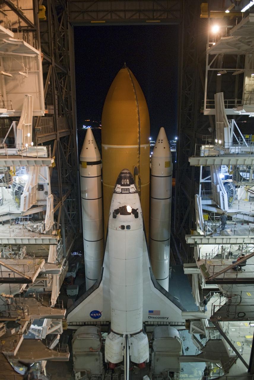 CAPE CANAVERAL, Fla. -- At NASA's Kennedy Space Center in Florida, space shuttle Discovery begins its nighttime trek, known as "rollout," from the Vehicle Assembly Building to Launch Pad 39A. It will take the shuttle, attached to its external fuel tank, twin solid rocket boosters and mobile launcher platform, about seven hours to complete the move atop a crawler-transporter. This is the second time Discovery has rolled out to the pad for the STS-133 mission, and comes after a thorough check and modifications to the shuttle's external tank. Targeted to liftoff Feb. 24, Discovery will take the Permanent Multipurpose Module (PMM) packed with supplies and critical spare parts, as well as Robonaut 2 (R2) to the International Space Station. For more information on STS-133, visit www.nasa.gov/mission_pages/shuttle/shuttlemissions/sts133/. Photo credit: NASA/Jim Grossmann