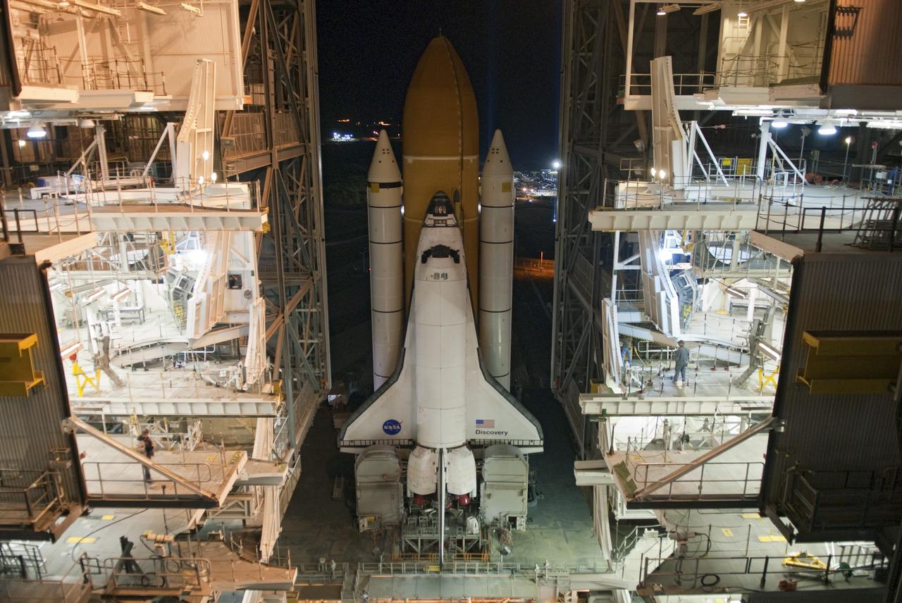 CAPE CANAVERAL, Fla. -- Space shuttle Discovery slowly rolls out of the Vehicle Assembly Building and heads toward Launch Pad 39A at NASA's Kennedy Space Center in Florida. The slow trek, known as "rollout," will take the shuttle, attached to its external fuel tank, twin solid rocket boosters and mobile launcher platform atop a crawler-transporter, about seven hours to complete. This is the second time Discovery has rolled out to the pad for the STS-133 mission, and comes after a thorough check and modifications to the shuttle's external tank. Targeted to liftoff Feb. 24, Discovery will take the Permanent Multipurpose Module (PMM) packed with supplies and critical spare parts, as well as Robonaut 2 (R2) to the International Space Station. For more information on STS-133, visit www.nasa.gov/mission_pages/shuttle/shuttlemissions/sts133/. Photo credit: NASA/Jim Grossmann