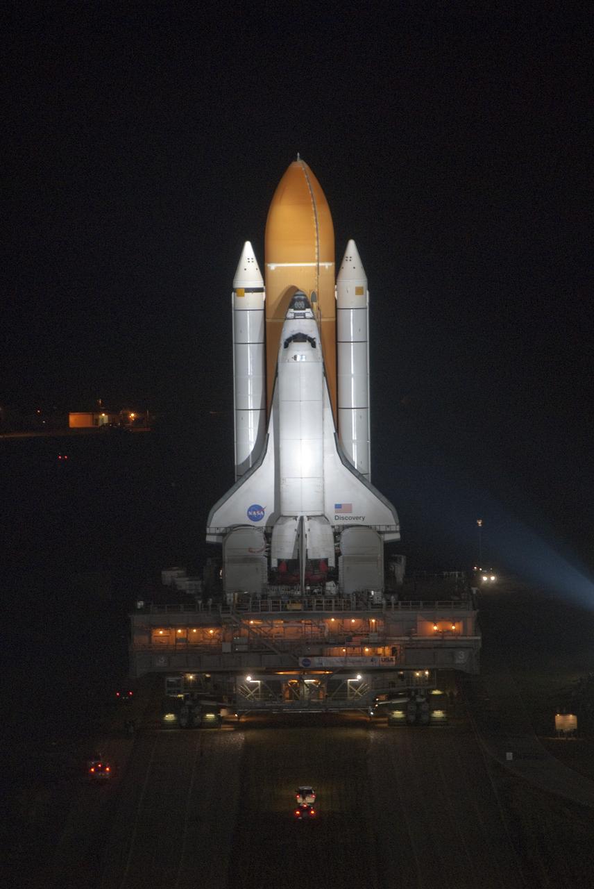 CAPE CANAVERAL, Fla. -- Xenon lights illuminate space shuttle Discovery as it makes its nighttime trek, known as "rollout," from the Vehicle Assembly Building to Launch Pad 39A at NASA's Kennedy Space Center in Florida. It will take the shuttle, attached to its external fuel tank, twin solid rocket boosters and mobile launcher platform, about seven hours to complete the move atop a crawler-transporter. This is the second time Discovery has rolled out to the pad for the STS-133 mission, and comes after a thorough check and modifications to the shuttle's external tank. Targeted to liftoff Feb. 24, Discovery will take the Permanent Multipurpose Module (PMM) packed with supplies and critical spare parts, as well as Robonaut 2 (R2) to the International Space Station. For more information on STS-133, visit www.nasa.gov/mission_pages/shuttle/shuttlemissions/sts133/. Photo credit: NASA/Jim Grossmann