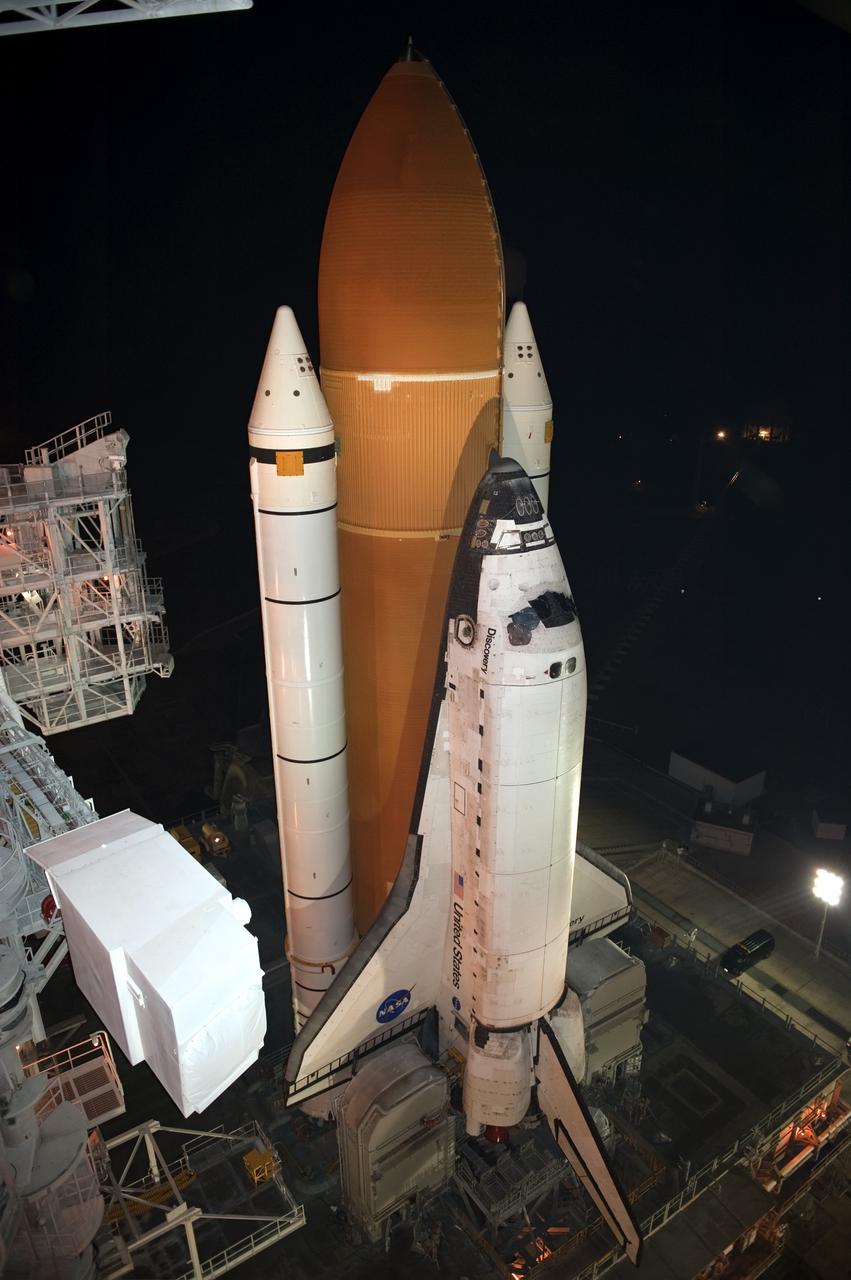CAPE CANAVERAL, Fla. -- Space shuttle Discovery arrives at Launch Pad 39A from the Vehicle Assembly Building at NASA's Kennedy Space Center in Florida. It took the shuttle, attached to its external fuel tank, twin solid rocket boosters and mobile launcher platform, about seven hours to complete the move atop a crawler-transporter. This is the second time Discovery has rolled out to the pad for the STS-133 mission, and comes after a thorough check and modifications to the shuttle's external tank. Targeted to liftoff Feb. 24, Discovery will take the Permanent Multipurpose Module (PMM) packed with supplies and critical spare parts, as well as Robonaut 2 (R2) to the International Space Station. For more information on STS-133, visit www.nasa.gov/mission_pages/shuttle/shuttlemissions/sts133/. Photo credit: NASA/Kim Shiflett