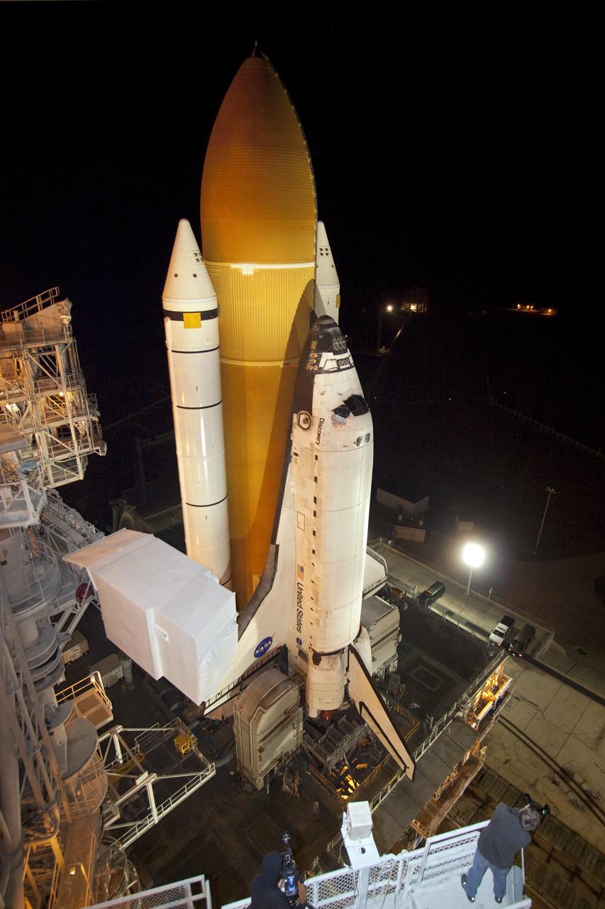 CAPE CANAVERAL, Fla. -- Space shuttle Discovery arrives at Launch Pad 39A from the Vehicle Assembly Building at NASA's Kennedy Space Center in Florida. It took the shuttle, attached to its external fuel tank, twin solid rocket boosters and mobile launcher platform, about seven hours to complete the move atop a crawler-transporter. This is the second time Discovery has rolled out to the pad for the STS-133 mission, and comes after a thorough check and modifications to the shuttle's external tank. Targeted to liftoff Feb. 24, Discovery will take the Permanent Multipurpose Module (PMM) packed with supplies and critical spare parts, as well as Robonaut 2 (R2) to the International Space Station. For more information on STS-133, visit www.nasa.gov/mission_pages/shuttle/shuttlemissions/sts133/. Photo credit: NASA/Jack Pfaller