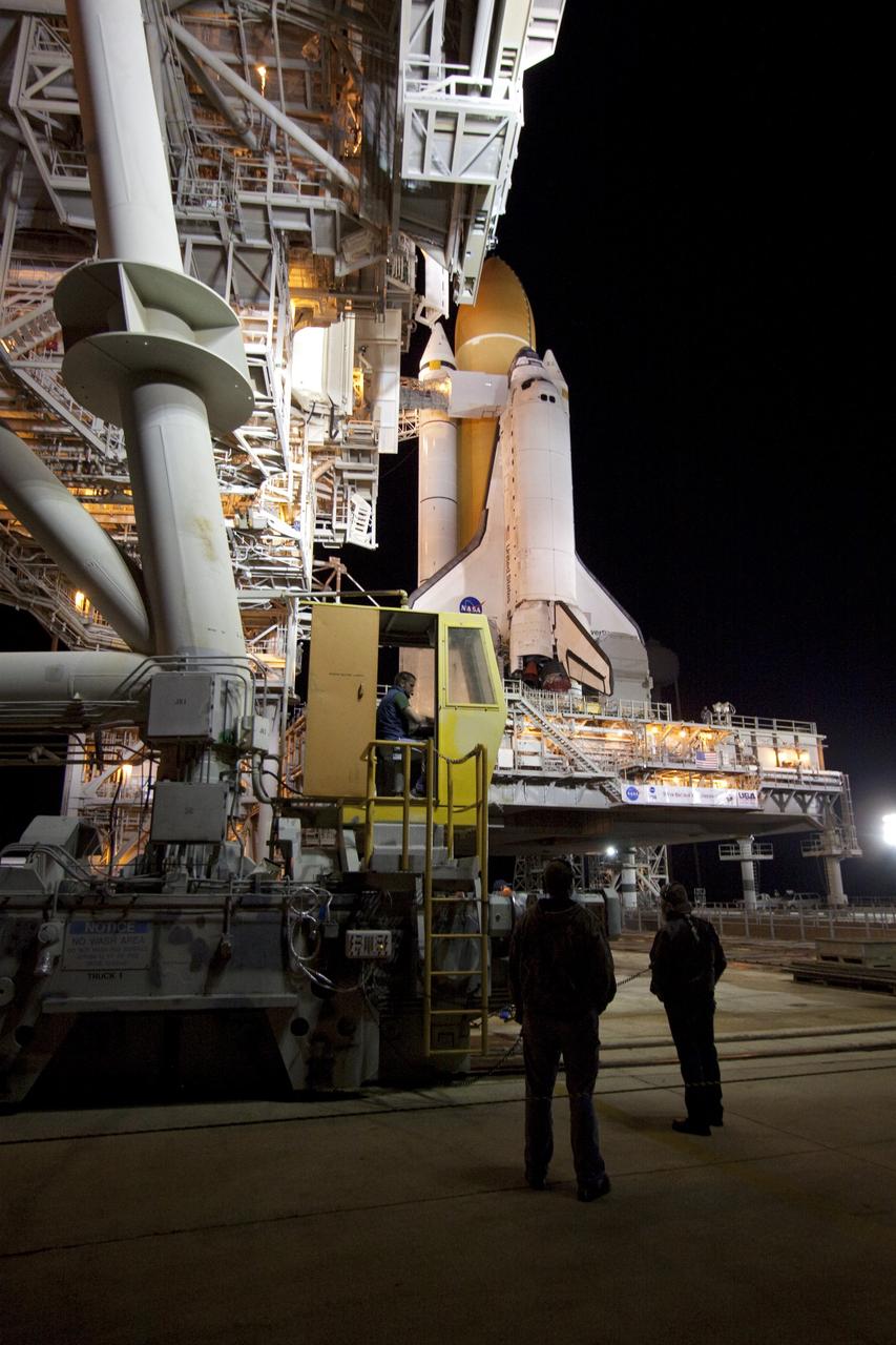 CAPE CANAVERAL, Fla. -- The rotating service structure (RSS), which provides weather protection and access to the shuttle, begins to move into place around space shuttle Discovery on Launch Pad 39A at NASA's Kennedy Space Center in Florida. This comes after Discovery, attached to its external fuel tank, twin solid rocket boosters and mobile launcher platform, rolled out to the pad from the Vehicle Assembly Building during the overnight hours. Rollout to the pad is a significant shuttle processing milestone for the upcoming STS-133 mission, and comes after a thorough check and modifications to the shuttle's external fuel tank. Targeted to liftoff Feb. 24, Discovery will take the Permanent Multipurpose Module (PMM) packed with supplies and critical spare parts, as well as Robonaut 2 (R2) to the International Space Station. For more information on STS-133, visit www.nasa.gov/mission_pages/shuttle/shuttlemissions/sts133/. Photo credit: NASA/Jack Pfaller