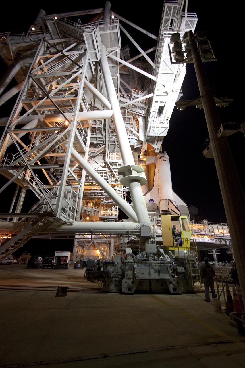 CAPE CANAVERAL, Fla. -- The rotating service structure (RSS), which provides weather protection and access to the shuttle, begins to move into place around space shuttle Discovery on Launch Pad 39A at NASA's Kennedy Space Center in Florida. This comes after Discovery, attached to its external fuel tank, twin solid rocket boosters and mobile launcher platform, rolled out to the pad from the Vehicle Assembly Building during the overnight hours. Rollout to the pad is a significant shuttle processing milestone for the upcoming STS-133 mission, and comes after a thorough check and modifications to the shuttle's external fuel tank. Targeted to liftoff Feb. 24, Discovery will take the Permanent Multipurpose Module (PMM) packed with supplies and critical spare parts, as well as Robonaut 2 (R2) to the International Space Station. For more information on STS-133, visit www.nasa.gov/mission_pages/shuttle/shuttlemissions/sts133/. Photo credit: NASA/Jack Pfaller