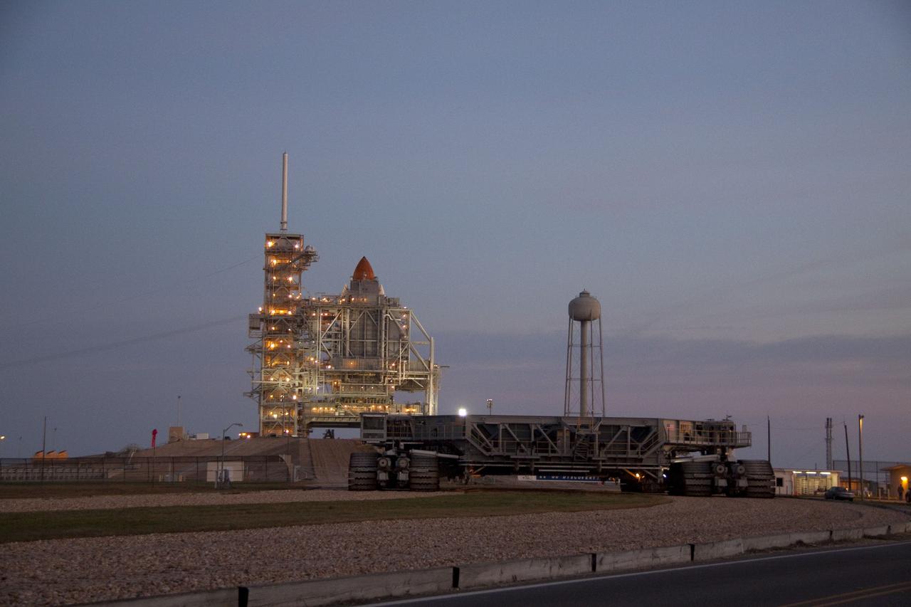 CAPE CANAVERAL, Fla. -- Dawn breaks over the Atlantic Ocean near Launch Pad 39A at NASA's Kennedy Space Center in Florida to reveal space shuttle Discovery newly arrived for its upcoming launch. First motion on its 3.4-mile trip from the Vehicle Assembly Building was at 7:58 p.m. EST Jan. 31, and was secured or "hard down" on the pad a little before 3 a.m. Feb. 1. Discovery's next launch opportunity to the International Space Station on the STS-133 mission is targeted for Feb. 24. For more information on STS-133, visit www.nasa.gov/mission_pages/shuttle/shuttlemissions/sts133/. Photo credit: NASA/Jack Pfaller