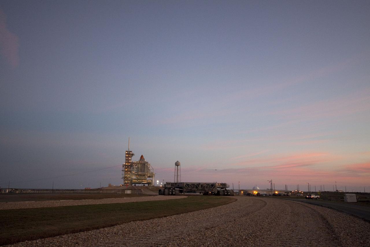 CAPE CANAVERAL, Fla. -- Dawn breaks over the Atlantic Ocean near Launch Pad 39A at NASA's Kennedy Space Center in Florida to reveal space shuttle Discovery newly arrived for its upcoming launch. First motion on its 3.4-mile trip from the Vehicle Assembly Building was at 7:58 p.m. EST Jan. 31, and was secured or "hard down" on the pad a little before 3 a.m. Feb. 1. Discovery's next launch opportunity to the International Space Station on the STS-133 mission is targeted for Feb. 24. For more information on STS-133, visit www.nasa.gov/mission_pages/shuttle/shuttlemissions/sts133/. Photo credit: NASA/Jack Pfaller