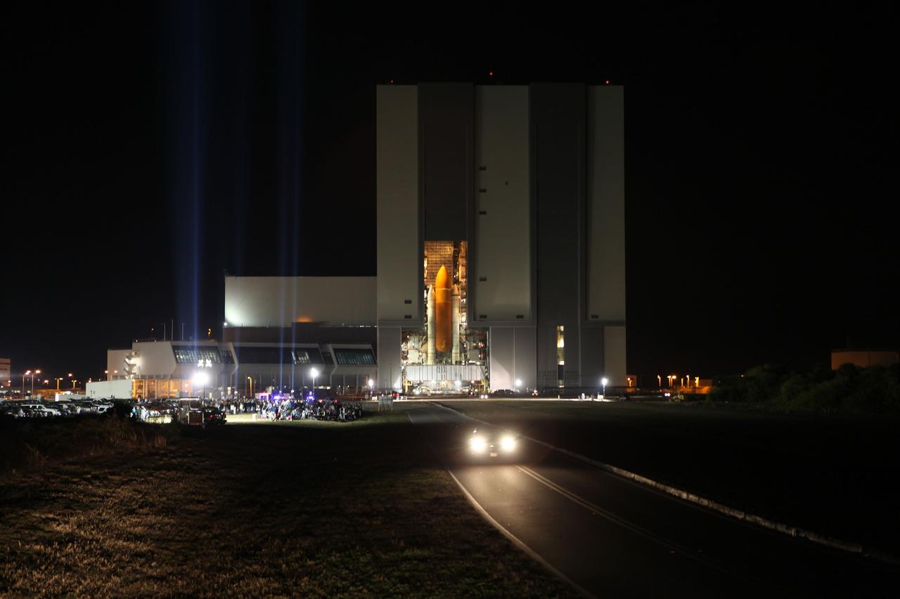 CAPE CANAVERAL, Fla. -- At NASA's Kennedy Space Center in Florida, space shuttle Discovery, perched on a crawler-transporter, begins a nighttime trek out of the massive Vehicle Assembly Building, on its 3.4-mile journey to Launch Pad 39A. It will take the shuttle, attached to its external fuel tank, twin solid rocket boosters and mobile launcher platform, about seven hours to complete the move. This is the second time Discovery has rolled out to the pad for the STS-133 mission, and comes after a thorough check and modifications to the shuttle's external tank. Targeted to liftoff Feb. 24, Discovery will take the Permanent Multipurpose Module (PMM) packed with supplies and critical spare parts, as well as Robonaut 2 (R2) to the International Space Station. For more information on STS-133, visit www.nasa.gov/mission_pages/shuttle/shuttlemissions/sts133/. Photo credit: NASA/Frank Michaux