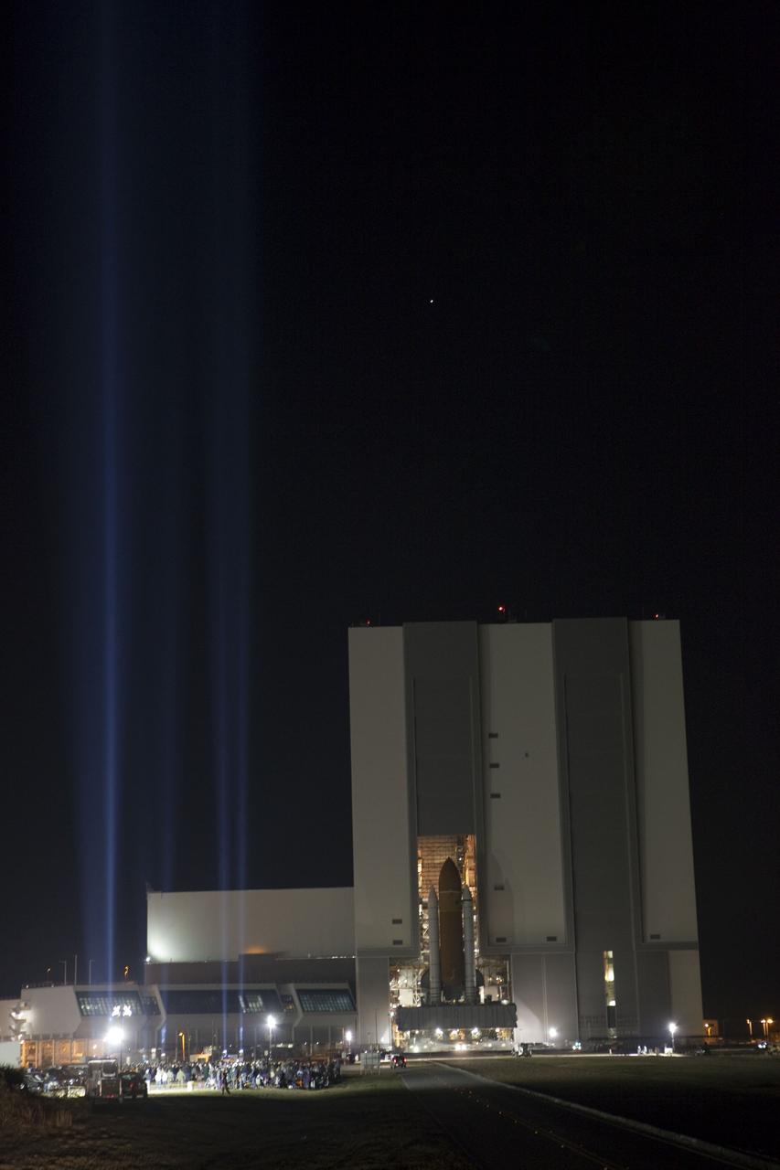 CAPE CANAVERAL, Fla. -- At NASA's Kennedy Space Center in Florida, space shuttle Discovery, perched on a crawler-transporter, begins a nighttime trek out of the massive Vehicle Assembly Building, on its 3.4-mile journey to Launch Pad 39A. It will take the shuttle, attached to its external fuel tank, twin solid rocket boosters and mobile launcher platform, about seven hours to complete the move. This is the second time Discovery has rolled out to the pad for the STS-133 mission, and comes after a thorough check and modifications to the shuttle's external tank. Targeted to liftoff Feb. 24, Discovery will take the Permanent Multipurpose Module (PMM) packed with supplies and critical spare parts, as well as Robonaut 2 (R2) to the International Space Station. For more information on STS-133, visit www.nasa.gov/mission_pages/shuttle/shuttlemissions/sts133/. Photo credit: NASA/Frank Michaux