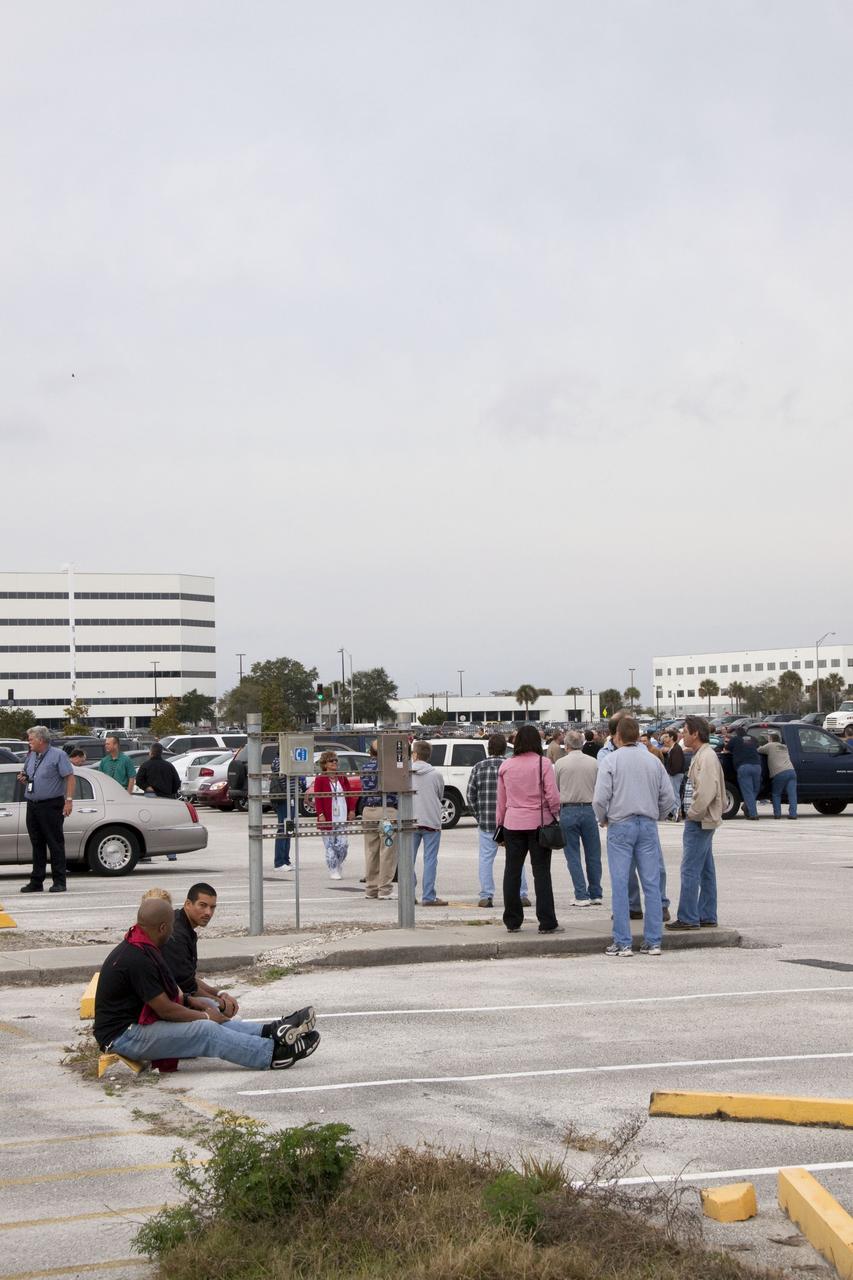 CAPE CANAVERAL, Fla. -- Workers wait to return to their buildings at NASA's Kennedy Space Center in Florida, after a backhoe inadvertently struck a natural gas line at around 8:40 a.m. EST in the area north of the Multi Function Facility (MFF). As a precaution, personnel were evacuated from Orbiter Processing Facilities 1 and 2, the MFF, Processing Control Center and Operations Support Building (OSB) I. All traffic was blocked on the Saturn Causeway near the facilities. There were no injuries or damage to any facilities and personnel were allowed back into their buildings before mid-day and the roadway open to traffic. Photo credit: NASA/Jack Pfaller