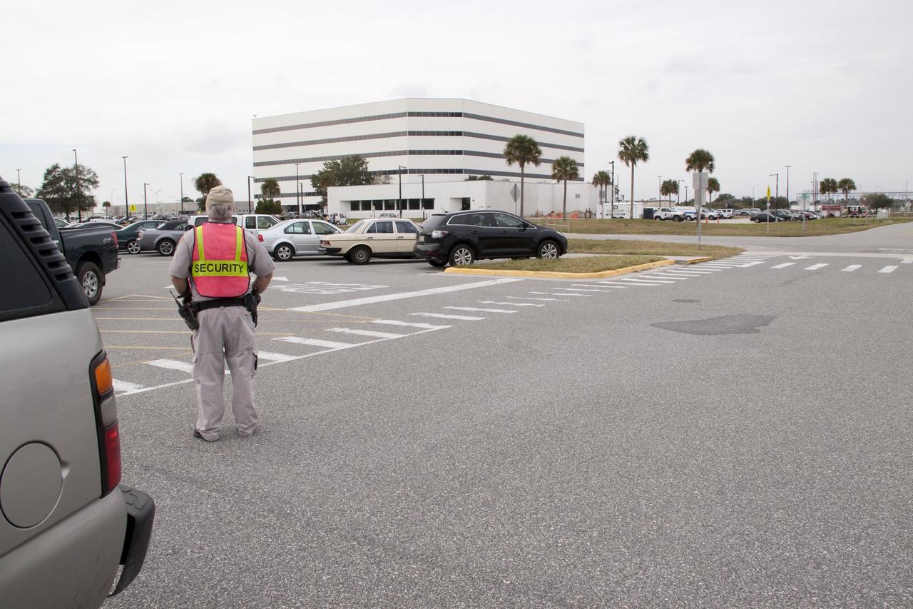 CAPE CANAVERAL, Fla. -- At NASA's Kennedy Space Center in Florida, a security officer monitors the area after a backhoe inadvertently struck a natural gas line at around 8:40 a.m. EST in the area north of the Multi Function Facility (MFF). As a precaution, personnel were evacuated from Orbiter Processing Facilities 1 and 2, the MFF, Processing Control Center and Operations Support Building (OSB) I. All traffic was blocked on the Saturn Causeway near the facilities. There were no injuries or damage to any facilities and personnel were allowed back into their buildings before mid-day and the roadway open to traffic. Photo credit: NASA/Jack Pfaller