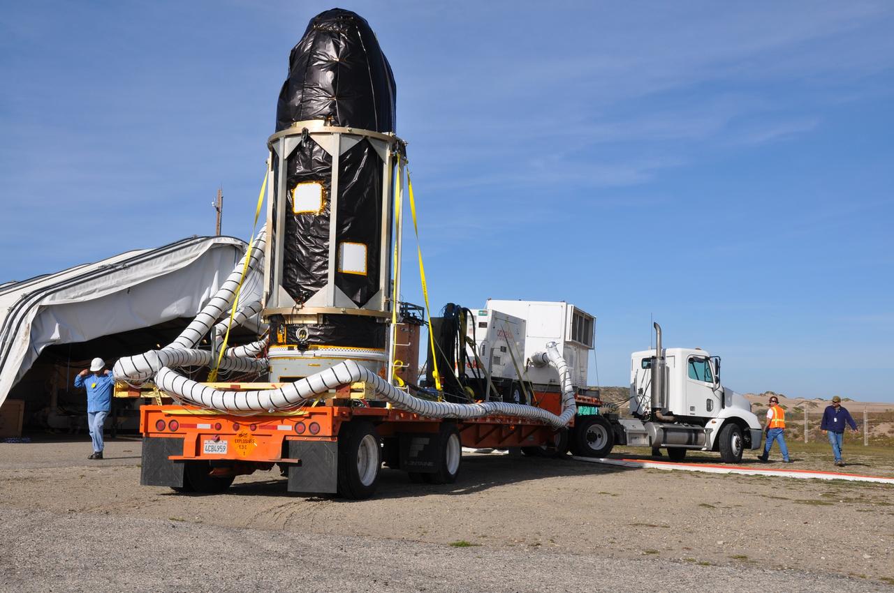 VANDENBERG AIR FORCE BASE, Calif. -- At Vandenberg Air Force Base in California, NASA's Glory spacecraft, encapsulated in its protective fairing, has arrived at Space Launch Complex 576-E. There it will be joined with the Taurus XL rocket's third stage, already delivered to a temporary processing tent near the pad.  The Orbital Sciences Corp. Taurus XL rocket will carry Glory into low Earth orbit. Once Glory reaches orbit, it will collect data on the properties of aerosols and black carbon. It also will help scientists understand how the sun's irradiance affects Earth's climate. Launch is scheduled for 5:09 a.m. EST Feb. 23. For information, visit www.nasa.gov/glory. Photo credit: NASA/Randy Beaudoin, VAFB