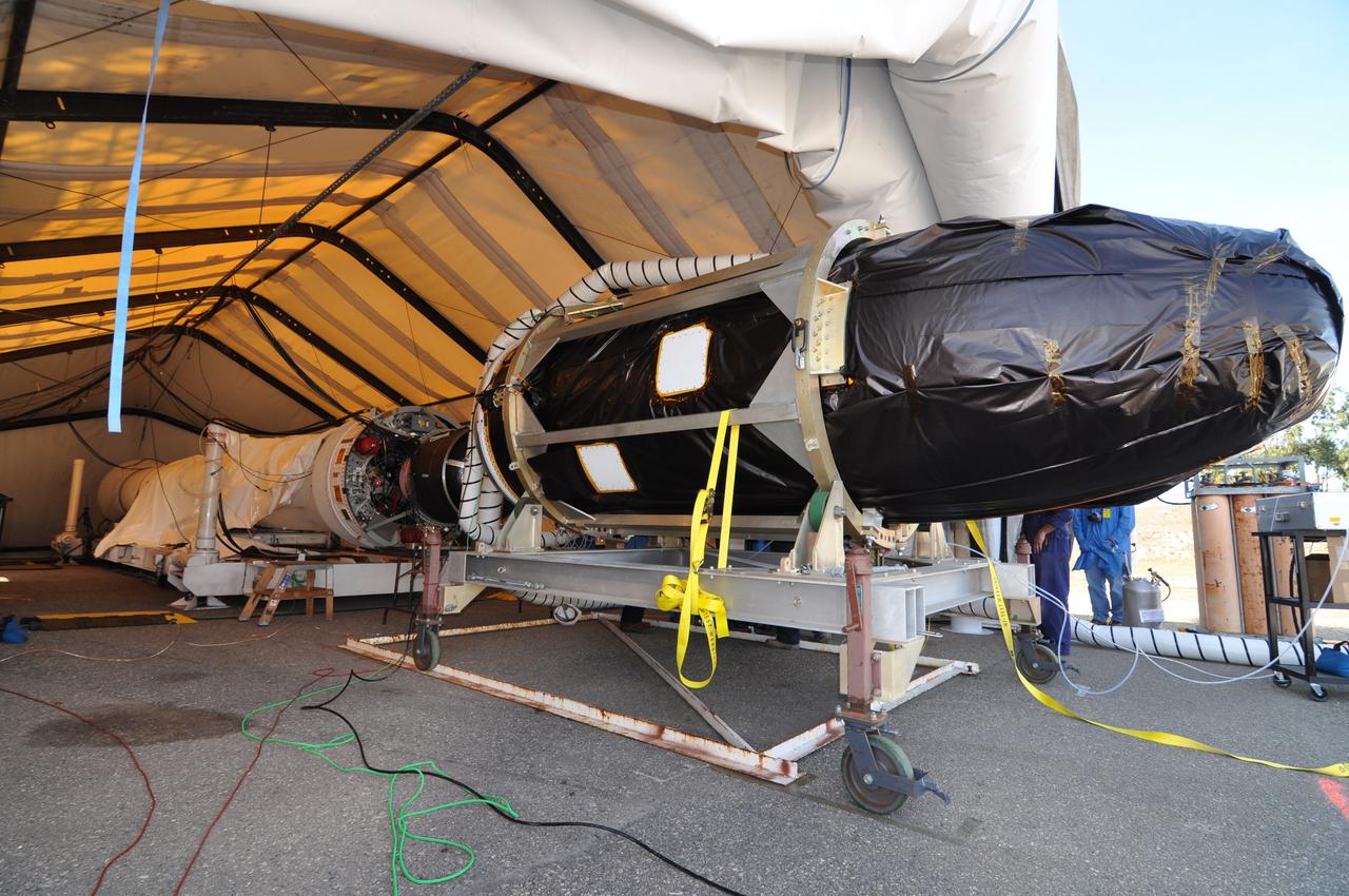 VANDENBERG AIR FORCE BASE, Calif. -- At Space Launch Complex 576-E at Vandenberg Air Force Base in California, workers have moved NASA's Glory spacecraft into position where it will be joined with the Taurus XL rocket's third stage already delivered to a temporary processing tent near the pad.        The Orbital Sciences Corp. Taurus XL rocket will carry Glory into low Earth orbit. Once Glory reaches orbit, it will collect data on the properties of aerosols and black carbon. It also will help scientists understand how the sun's irradiance affects Earth's climate. Launch is scheduled for 5:09 a.m. EST Feb. 23. For information, visit www.nasa.gov/glory. Photo credit: NASA/Randy Beaudoin, VAFB