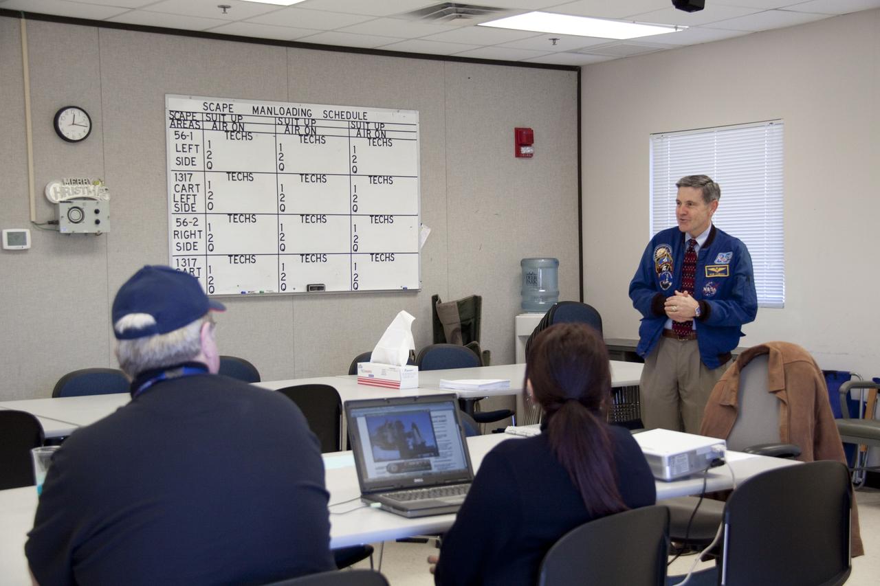 CAPE CANAVERAL, Fla. -- At NASA's Kennedy Space Center in Florida, Center Director Bob Cabana speaks to members of an emergency escape training class. The training is required every 18 months to certify Fire Rescue and Closeout Crew personnel. For several days, volunteers portraying astronauts, take part in a training exercise that allows teams to practice emergency response procedures at Launch Pad 39A, including helicopter evacuation to local hospitals. Training normally involves NASA fire rescue personnel, helicopters and personnel from the Air Force's 920th Rescue Wing, and medical trauma teams from central Florida hospitals. Photo credit: NASA/Troy Cryder
