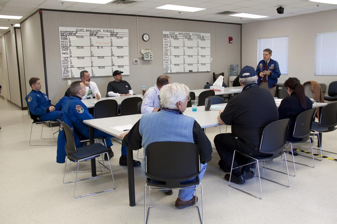 CAPE CANAVERAL, Fla. -- At NASA's Kennedy Space Center in Florida, Center Director Bob Cabana speaks to members of an emergency escape training class. The training is required every 18 months to certify Fire Rescue and Closeout Crew personnel. For several days, volunteers portraying astronauts, take part in a training exercise that allows teams to practice emergency response procedures at Launch Pad 39A, including helicopter evacuation to local hospitals. Training normally involves NASA fire rescue personnel, helicopters and personnel from the Air Force's 920th Rescue Wing, and medical trauma teams from central Florida hospitals. Photo credit: NASA/Troy Cryder