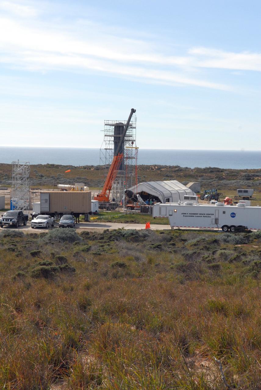 VANDENBERG AIR FORCE BASE, Calif. -- At Space Launch Complex 576-E at Vandenberg Air Force Base in California, a crane lifts NASA's Glory spacecraft, encapsulated in its protective fairing, off of a transport. It will then be joined with the Taurus XL rocket's third stage, already delivered to a temporary processing tent near the pad. The Orbital Sciences Corp. Taurus XL rocket will carry Glory into low Earth orbit.         Once Glory reaches orbit, it will collect data on the properties of aerosols and black carbon. It also will help scientists understand how the sun's irradiance affects Earth's climate. Launch is scheduled for 5:09 a.m. EST Feb. 23. For information, visit www.nasa.gov/glory. Photo credit: NASA/Jerry E. Clemens Jr., VAFB