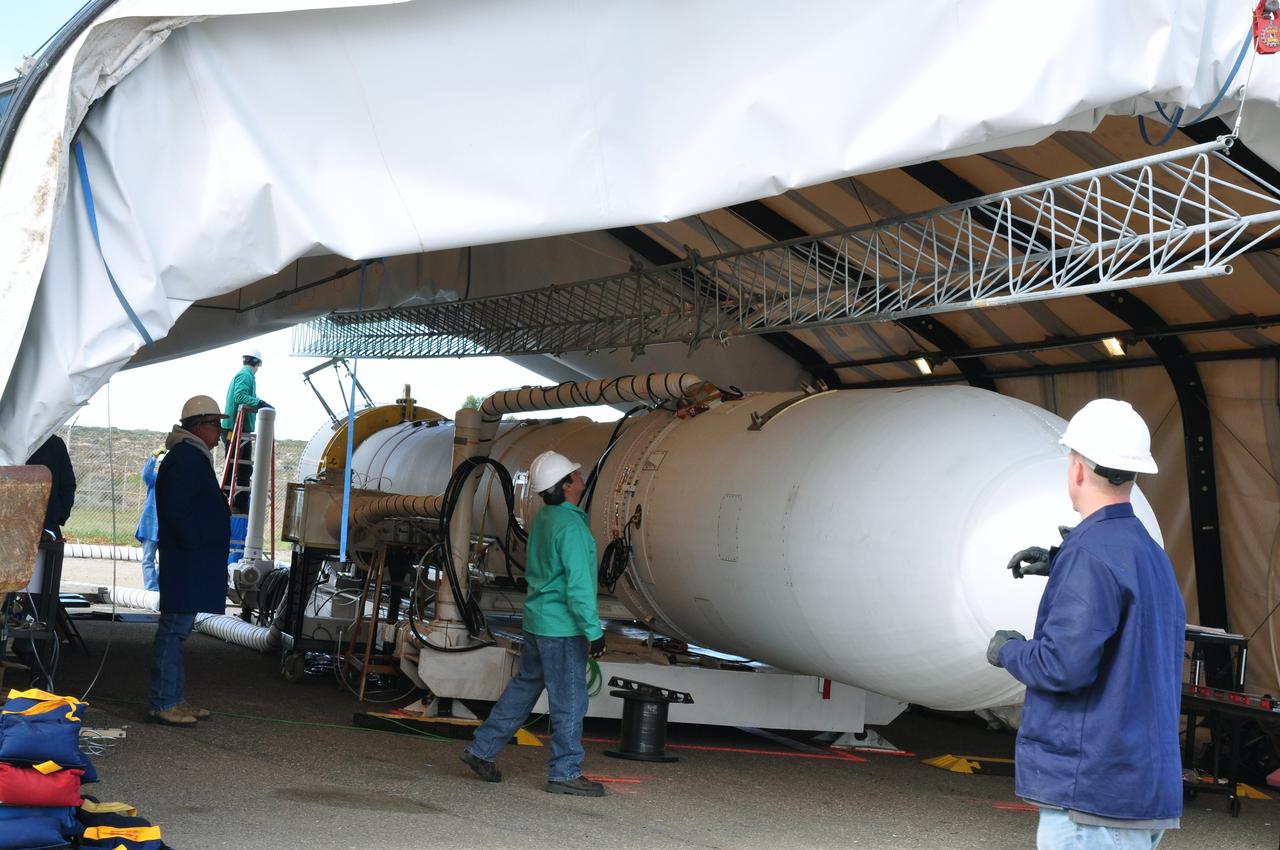 VANDENBERG AIR FORCE BASE, Calif. -- At Space Launch Complex 576-E at Vandenberg Air Force Base in California, workers join the upper umbilical tower to NASA's Glory spacecraft, already integrated with the upper stack of the Taurus rocket. During liftoff this tower falls away from the spacecraft.    The Orbital Sciences Corp. Taurus XL rocket will launch Glory into low Earth orbit. Once Glory reaches orbit, it will collect data on the properties of aerosols and black carbon. It also will help scientists understand how the sun's irradiance affects Earth's climate. Launch is scheduled for 5:09 a.m. EST Feb. 23. For information, visit www.nasa.gov/glory. Photo credit: NASA/Randy Beaudoin, VAFB