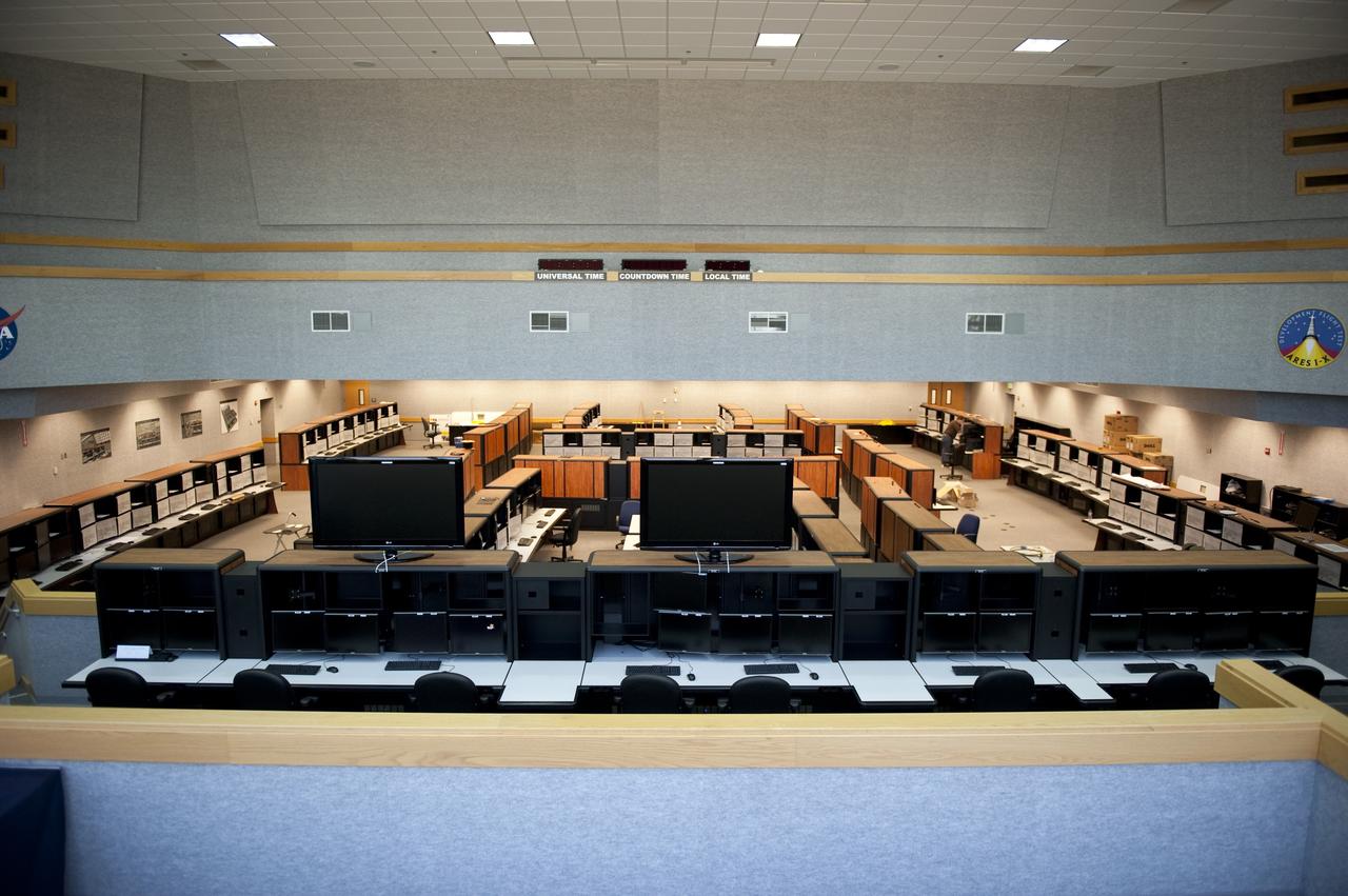 CAPE CANAVERAL, Fla. -- At NASA's Kennedy Space Center in Florida, remodeling for launches of future human spaceflight vehicles takes place in the Launch Control Center's Young-Crippen Firing Room. Consoles already have been rewired for the comprehensive upgrade and are now being outfitted with new computers and monitors. From here, the launch team members who give a final "go/no-go" to launch, can see the rest of the team.          Known as Firing Room 1 in the Apollo era, it was re-named as a tribute to the Space Shuttle Program's first crewed mission, STS-1, which was flown by Commander John Young and Pilot Robert Crippen in April 1981. The firing room most recently was set up to support the Ares I-X flight test in Oct. 2009. Photo credit: NASA/Kim Shiflett
