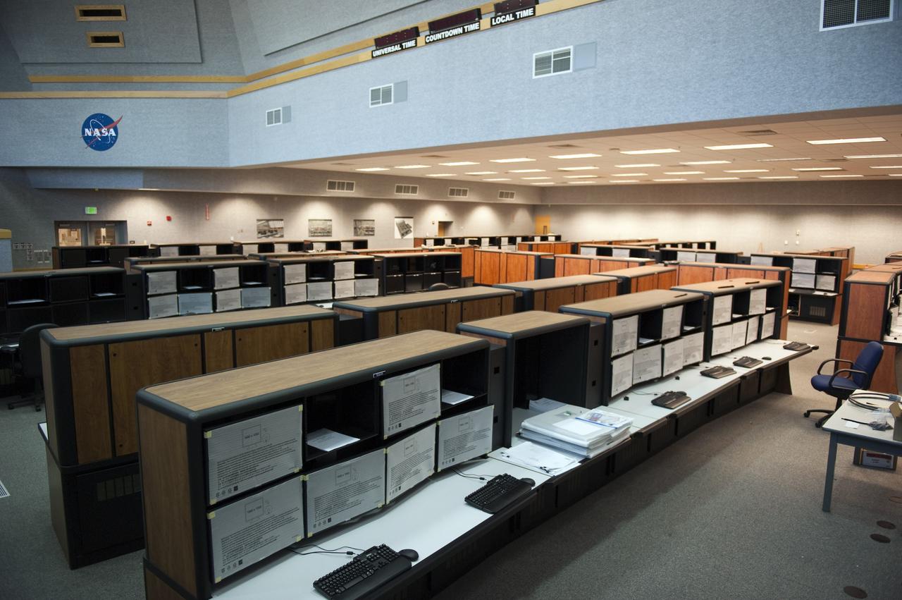 CAPE CANAVERAL, Fla. -- At NASA's Kennedy Space Center in Florida, remodeling for launches of future human spaceflight vehicles continues in the Launch Control Center's Young-Crippen Firing Room. Consoles already have been rewired for the comprehensive upgrade and are now being outfitted with new computers and monitors.        Known as Firing Room 1 in the Apollo era, it was re-named as a tribute to the Space Shuttle Program's first crewed mission, STS-1, which was flown by Commander John Young and Pilot Robert Crippen in April 1981. The firing room most recently was set up to support the Ares I-X flight test in Oct. 2009. Photo credit: NASA/Kim Shiflett