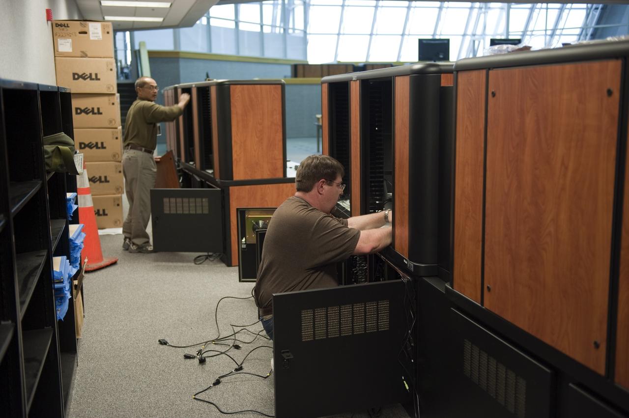 CAPE CANAVERAL, Fla. -- At NASA's Kennedy Space Center in Florida, remodeling for launches of future human spaceflight vehicles continues in the Launch Control Center's Young-Crippen Firing Room. Consoles already have been rewired for the comprehensive upgrade and are now being outfitted with new computers and monitors.        Known as Firing Room 1 in the Apollo era, it was re-named as a tribute to the Space Shuttle Program's first crewed mission, STS-1, which was flown by Commander John Young and Pilot Robert Crippen in April 1981. The firing room most recently was set up to support the Ares I-X flight test in Oct. 2009. Photo credit: NASA/Kim Shiflett