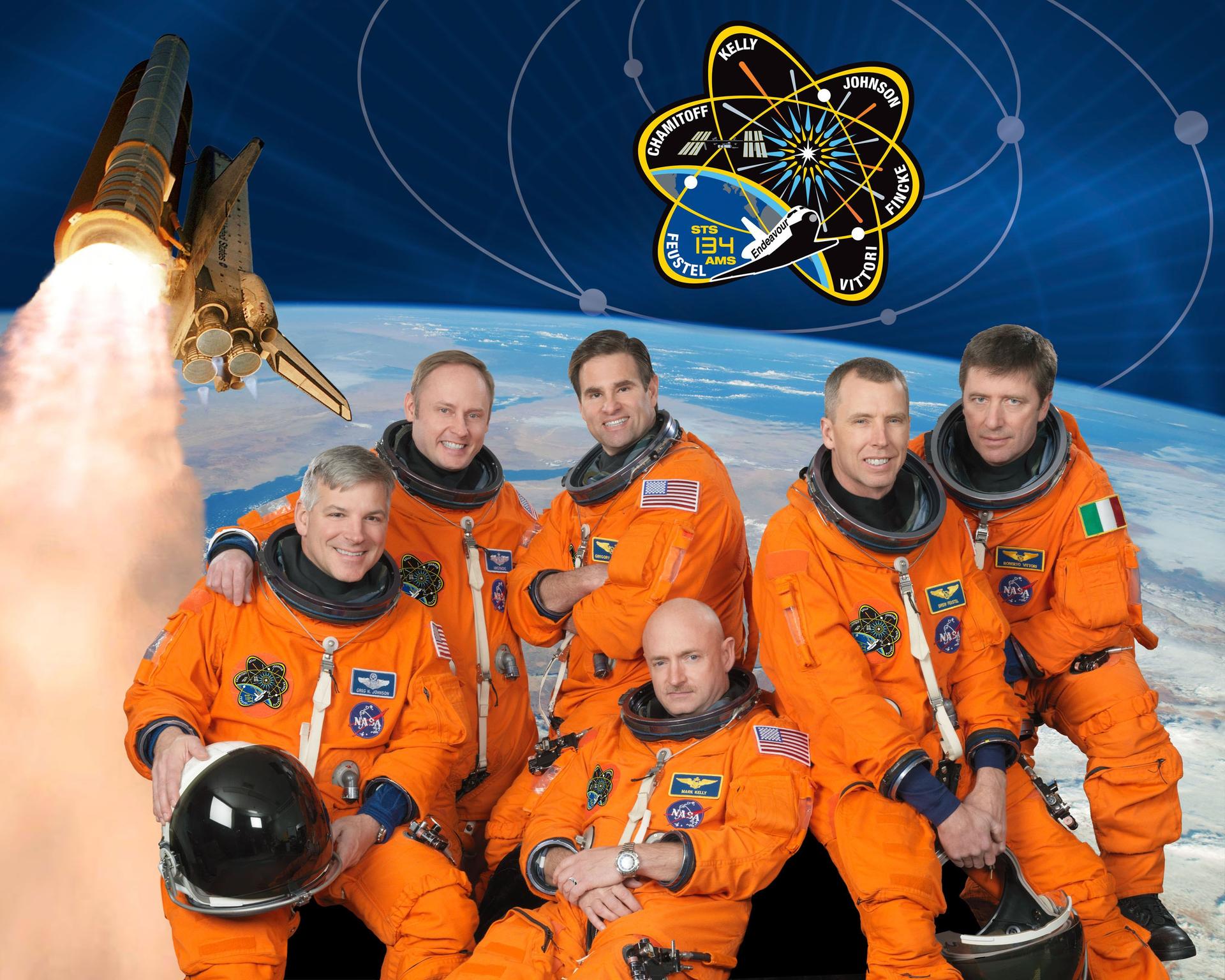 Attired in training versions of their shuttle launch-and-entry suits, these six astronauts take a break from training to pose for the STS-134 crew portrait.