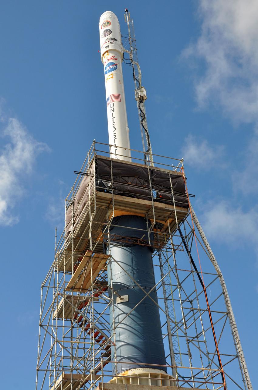 VANDENBERG AIR FORCE BASE, Calif. -- On Space Launch Complex 576-E at Vandenberg Air Force Base in California, the Taurus XL rocket is in its launch configuration. The upper stack, consisting of Stages 1, 2 and 3, as well as the encapsulated Glory spacecraft, is attached to an interstage and Stage 0 at the launch pad. The scaffolding around Stage 0 will be removed prior to next week's launch, after workers install 12 vent-door covers to the interstage.    The Orbital Sciences Taurus XL rocket will launch Glory into low Earth orbit. Once Glory reaches orbit, it will collect data on the properties of aerosols and black carbon. It also will help scientists understand how the sun's irradiance affects Earth's climate. Launch is scheduled for 5:09 a.m. EST Feb. 23. For information, visit www.nasa.gov/glory. Photo credit: NASA/Randy Beaudoin, VAFB