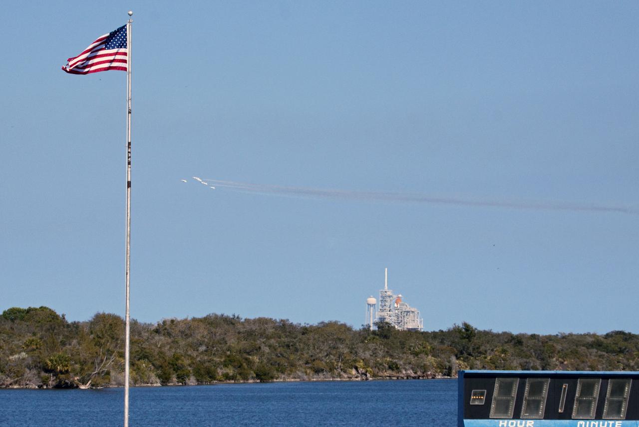 CAPE CANAVERAL, Fla. -- The U.S. Air Force Thunderbirds show their precision formation as they fly over Launch Pad 39A at NASA's Kennedy Space Center in Florida. They are taking part in the prerace festivities at the Daytona International Speedway for the 53rd running of the Daytona 500. Photo credit: NASA/Jack Pfaller