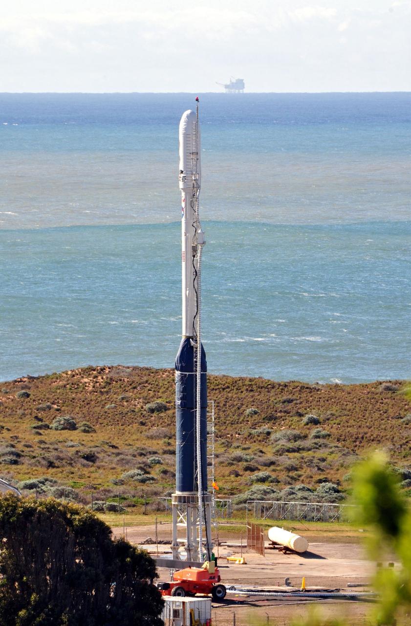 VANDENBERG AIR FORCE BASE, Calif. -- On Space Launch Complex 576-E at Vandenberg Air Force Base in California, the Taurus XL rocket is in its launch configuration. The upper stack, consisting of Stages 1, 2 and 3, as well as the encapsulated Glory spacecraft, is attached to an interstage and Stage 0 at the launch pad.         The Orbital Sciences Taurus XL rocket will launch Glory into low Earth orbit. Once Glory reaches orbit, it will collect data on the properties of aerosols and black carbon. It also will help scientists understand how the sun's irradiance affects Earth's climate. Launch is scheduled for 5:09 a.m. EST Feb. 23. For information, visit www.nasa.gov/glory. Photo credit: NASA/Randy Beaudoin, VAFB