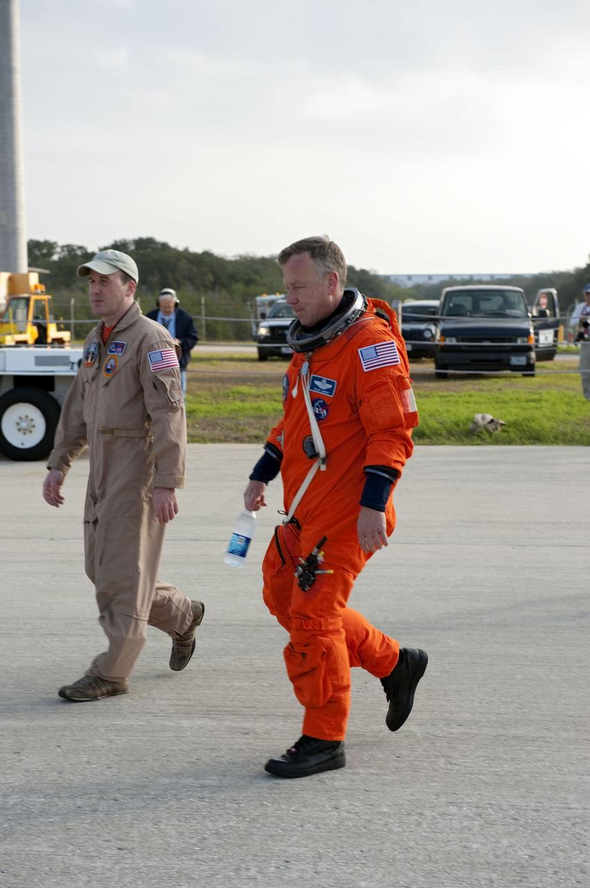 CAPE CANAVERAL, Fla. -- STS-133 Commander Steve Lindsey, right, arrives on the Shuttle Landing Facility runway at NASA's Kennedy Space Center in Florida to perform touch-and-go landings aboard a Shuttle Training Aircraft (STA). An STA is a Gulfstream II business jet that is modified to mimic the shuttle's handling during the final phase of landing. Lindsey and STS-133 Pilot Eric Boe will practice landings as part of standard training before space shuttle Discovery's launch to the International Space Station.              Scheduled to lift off Feb. 24 at 4:50 p.m. EST, Discovery and its six-member crew will deliver the Permanent Multipurpose Module, packed with supplies and critical spare parts, as well as Robonaut 2, the dexterous humanoid astronaut helper, to the orbiting outpost. For more information on the STS-133 mission, visit www.nasa.gov/mission_pages/shuttle/shuttlemissions/sts133/.  Photo credit: NASA/Kim Shiflett