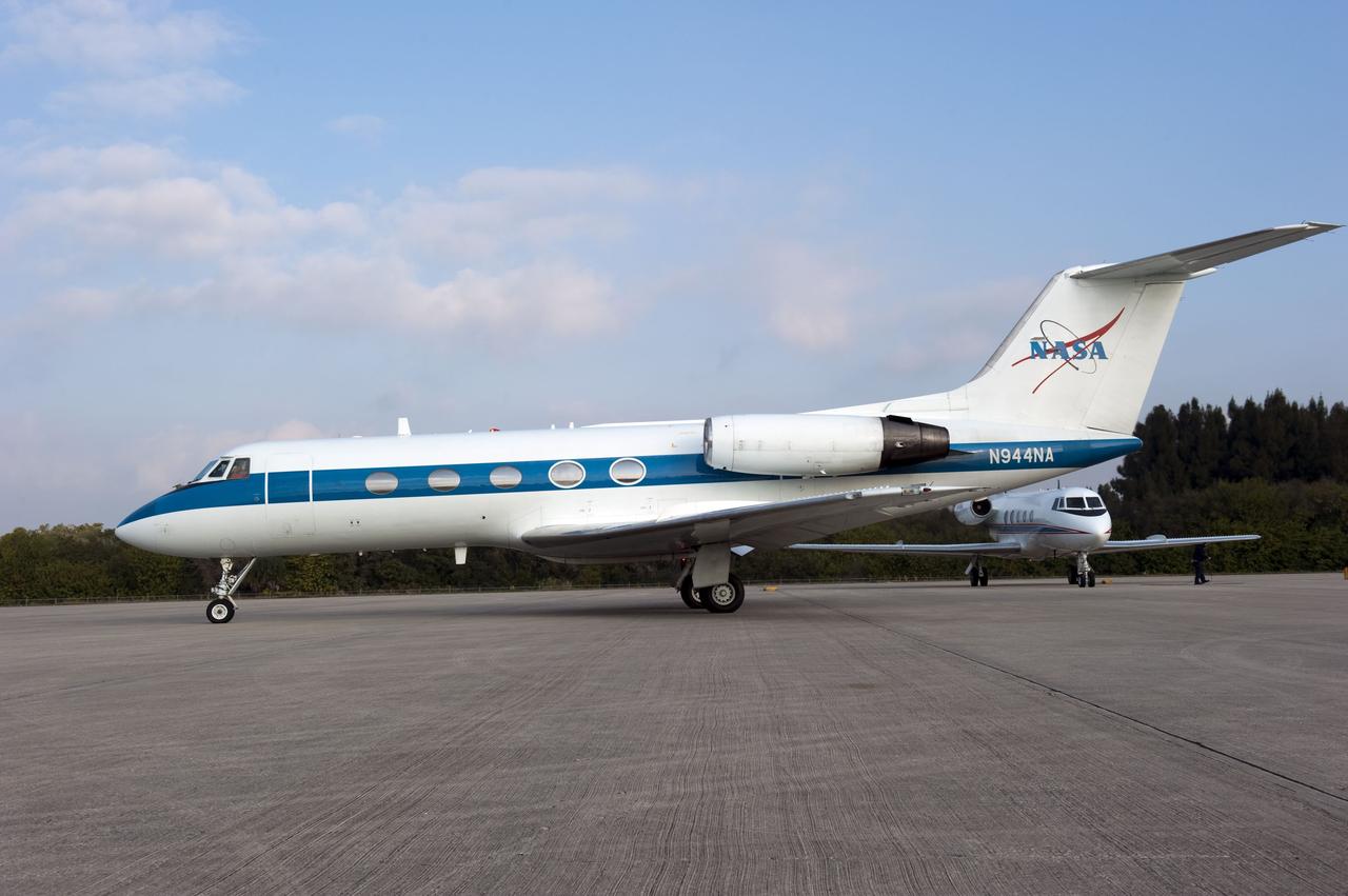 CAPE CANAVERAL, Fla. -- STS-133 Commander Steve Lindsey, foreground aircraft, and Pilot Eric Boe are ready to take off and perform touch-and-go landings aboard two Shuttle Training Aircraft (STA) on the Shuttle Landing Facility runway at NASA's Kennedy Space Center in Florida. STAs are Gulfstream II business jets that are modified to mimic the shuttle's handling during the final phase of landing. Practice landings are part of standard training before space shuttle Discovery's launch to the International Space Station.        Scheduled to lift off Feb. 24 at 4:50 p.m. EST, Discovery and its six-member crew will deliver the Permanent Multipurpose Module, packed with supplies and critical spare parts, as well as Robonaut 2, the dexterous humanoid astronaut helper, to the orbiting outpost. For more information on the STS-133 mission, visit www.nasa.gov/mission_pages/shuttle/shuttlemissions/sts133/.  Photo credit: NASA/Kim Shiflett