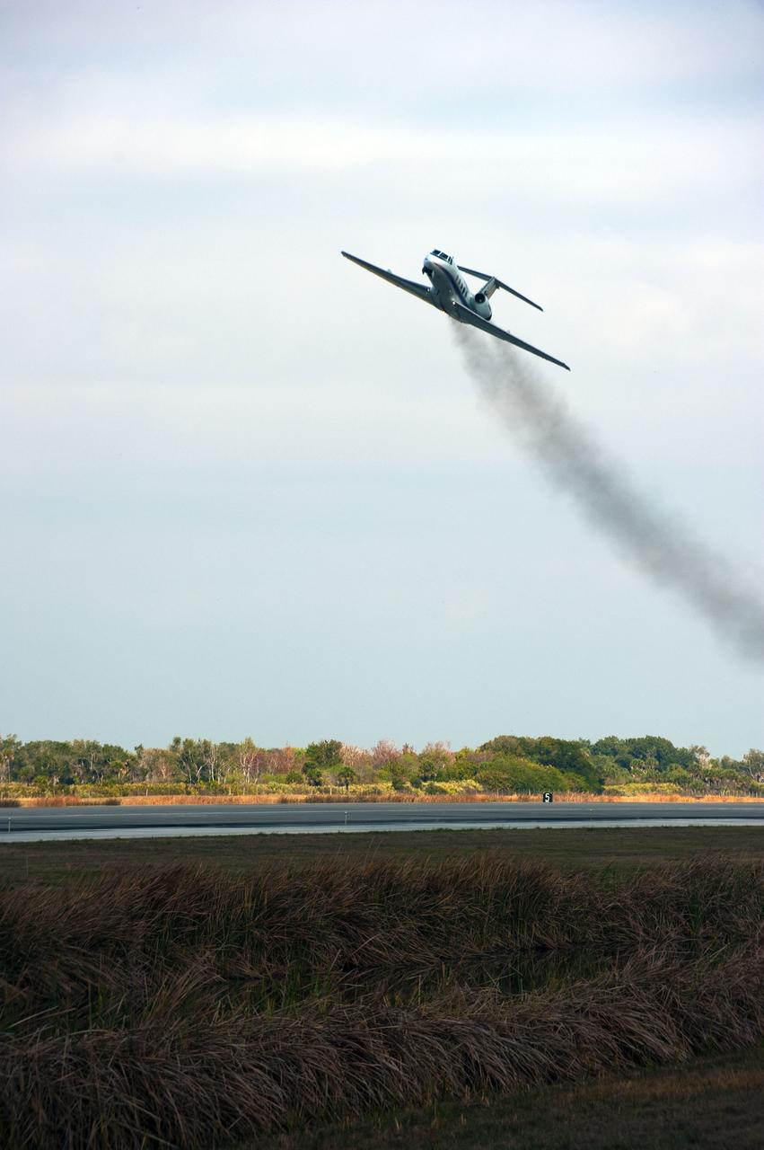 CAPE CANAVERAL, Fla. -- A Shuttle Training Aircraft (STA) performs touch-and-go landings over the Shuttle Landing Facility runway at NASA's Kennedy Space Center in Florida. STS-133 Commander Steve Lindsey and Pilot Eric Boe are flying two Gulfstream II business jets that are modified to mimic the shuttle's handling during the final phase of landing. These practice landings are part of standard training before space shuttle Discovery's launch to the International Space Station.        Scheduled to lift off Feb. 24 at 4:50 p.m. EST, Discovery and its six-member crew will deliver the Permanent Multipurpose Module, packed with supplies and critical spare parts, as well as Robonaut 2, the dexterous humanoid astronaut helper, to the orbiting outpost. For more information on the STS-133 mission, visit www.nasa.gov/mission_pages/shuttle/shuttlemissions/sts133/.  Photo credit: NASA/Kim Shiflett