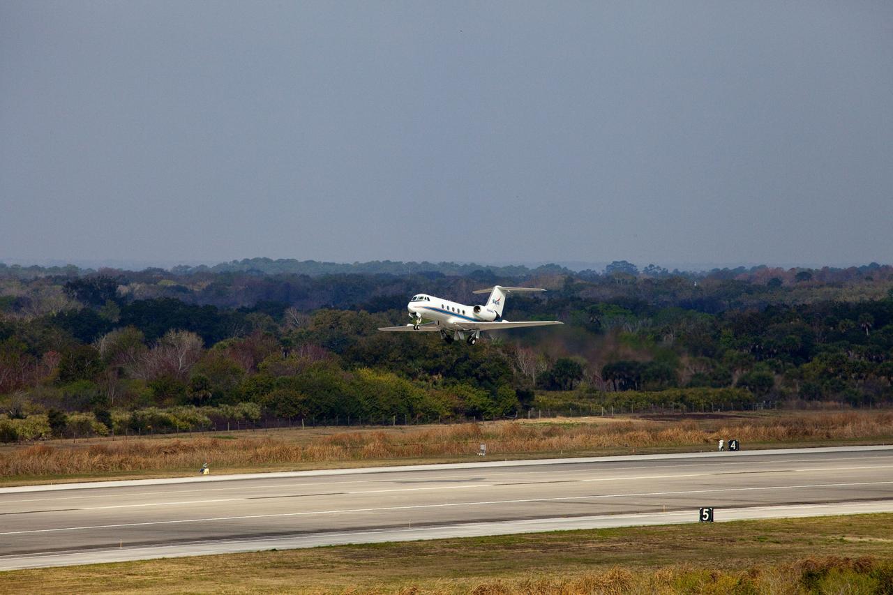 CAPE CANAVERAL, Fla. -- This image was taken from the Shuttle Landing Facility's air traffic control tower at NASA's Kennedy Space Center in Florida and provides a birds-eye view of STS-133 Pilot Eric Boe performing touch-and-go landings aboard one of two Shuttle Training Aircraft (STA).              STAs are Gulfstream II business jets that are modified to mimic the shuttle's handling during the final phase of landing. Practice landings are part of standard training before space shuttle Discovery's launch to the International Space Station.   Scheduled to lift off Feb. 24 at 4:50 p.m. EST, Discovery and its six-member crew will deliver the Permanent Multipurpose Module, packed with supplies and critical spare parts, as well as Robonaut 2, the dexterous humanoid astronaut helper, to the orbiting outpost. For more information on the STS-133 mission, visit www.nasa.gov/mission_pages/shuttle/shuttlemissions/sts133/. Photo credit: NASA/Ben Smegelsky