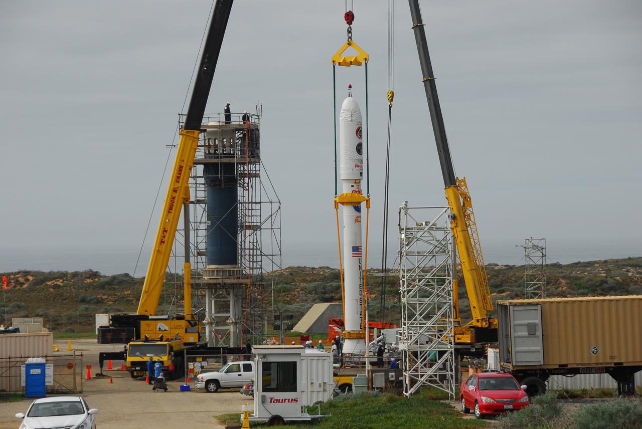 VANDENBERG AIR FORCE BASE, Calif. -- On Space Launch Complex 576-E at Vandenberg Air Force Base in California, Orbital Sciences workers monitor NASA's Glory upper stack as a crane lifts it from a stationary rail for attachment to the Taurus XL rocket's Stage 0. The upper stack consists of Stages 1, 2 and 3 of the Taurus as well as the encapsulated Glory spacecraft.       The Orbital Sciences Taurus XL rocket will launch Glory into low Earth orbit. Once Glory reaches orbit, it will collect data on the properties of aerosols and black carbon. It also will help scientists understand how the sun's irradiance affects Earth's climate. Launch is scheduled for 5:09 a.m. EST Feb. 23. For information, visit www.nasa.gov/glory. Photo credit: NASA/VAFB
