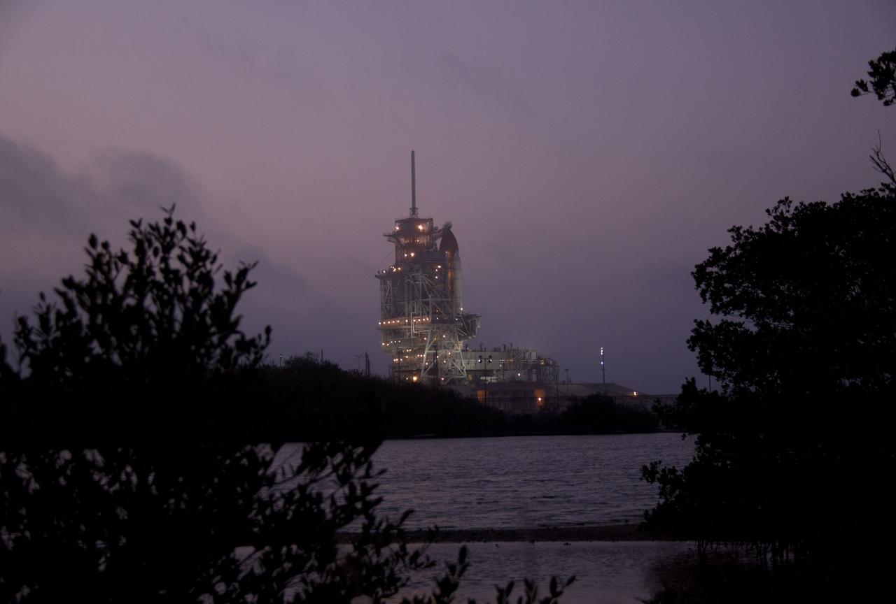 CAPE CANAVERAL, Fla. -- At NASA's Kennedy Space Center in Florida, the rotating service structure on Launch Pad 39A begins to move away from space shuttle Discovery. The structure provides weather protection and access to the shuttle while it awaits lift off on the pad. RSS "rollback," as it's called, began at 8:02 p.m. EST on Feb. 23 and wrapped up at 8:37 p.m. From here, cameras will catch the shuttle lift off amidst the space center's pristine wildlife refuge. Scheduled to lift off Feb. 24 at 4:50 p.m. EST, Discovery and its six-member crew will deliver the Permanent Multipurpose Module, packed with supplies and critical spare parts, as well as Robonaut 2, the dexterous humanoid astronaut helper, to the International Space Station. Discovery, which will fly its 39th mission, is scheduled to be retired following STS-133. This will be the 133rd Space Shuttle Program mission and the 35th shuttle voyage to the space station. For more information on the STS-133 mission, visit www.nasa.gov/mission_pages/shuttle/shuttlemissions/sts133/. Photo credit: NASA/Jack Pfaller
