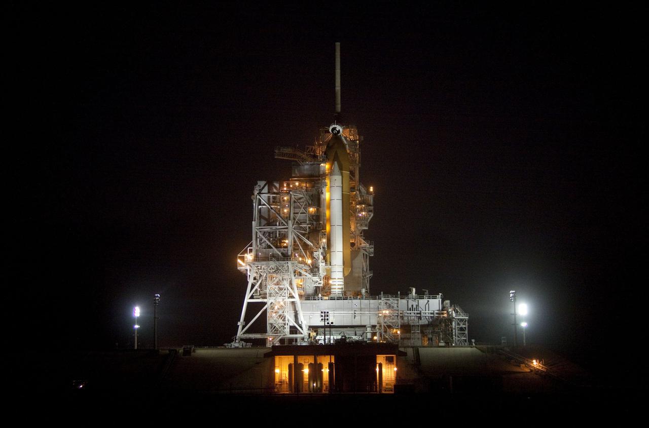 CAPE CANAVERAL, Fla. -- At NASA's Kennedy Space Center in Florida, the rotating service structure on Launch Pad 39A begins to move away from space shuttle Discovery, which is illuminated by bright xenon lights. The structure provides weather protection and access to the shuttle while it awaits lift off on the pad. RSS "rollback," as it's called, began at 8:02 p.m. EST on Feb. 23 and wrapped up at 8:37 p.m. Scheduled to lift off Feb. 24 at 4:50 p.m. EST, Discovery and its six-member crew will deliver the Permanent Multipurpose Module, packed with supplies and critical spare parts, as well as Robonaut 2, the dexterous humanoid astronaut helper, to the International Space Station. Discovery, which will fly its 39th mission, is scheduled to be retired following STS-133. This will be the 133rd Space Shuttle Program mission and the 35th shuttle voyage to the space station. For more information on the STS-133 mission, visit www.nasa.gov/mission_pages/shuttle/shuttlemissions/sts133/. Photo credit: NASA/Jack Pfaller