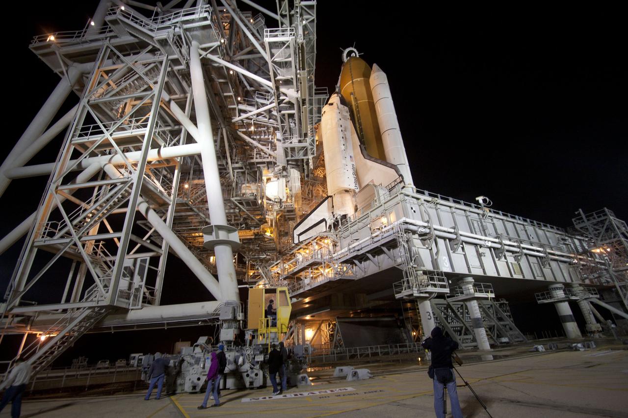 CAPE CANAVERAL, Fla. -- At NASA's Kennedy Space Center in Florida, the rotating service structure on Launch Pad 39A begins to move away from space shuttle Discovery, which is illuminated by bright xenon lights. The structure provides weather protection and access to the shuttle while it awaits lift off on the pad. RSS "rollback," as it's called, began at 8:02 p.m. EST on Feb. 23 and wrapped up at 8:37 p.m. Scheduled to lift off Feb. 24 at 4:50 p.m. EST, Discovery and its six-member crew will deliver the Permanent Multipurpose Module, packed with supplies and critical spare parts, as well as Robonaut 2, the dexterous humanoid astronaut helper, to the International Space Station. Discovery, which will fly its 39th mission, is scheduled to be retired following STS-133. This will be the 133rd Space Shuttle Program mission and the 35th shuttle voyage to the space station. For more information on the STS-133 mission, visit www.nasa.gov/mission_pages/shuttle/shuttlemissions/sts133/. Photo credit: NASA/Jack Pfaller