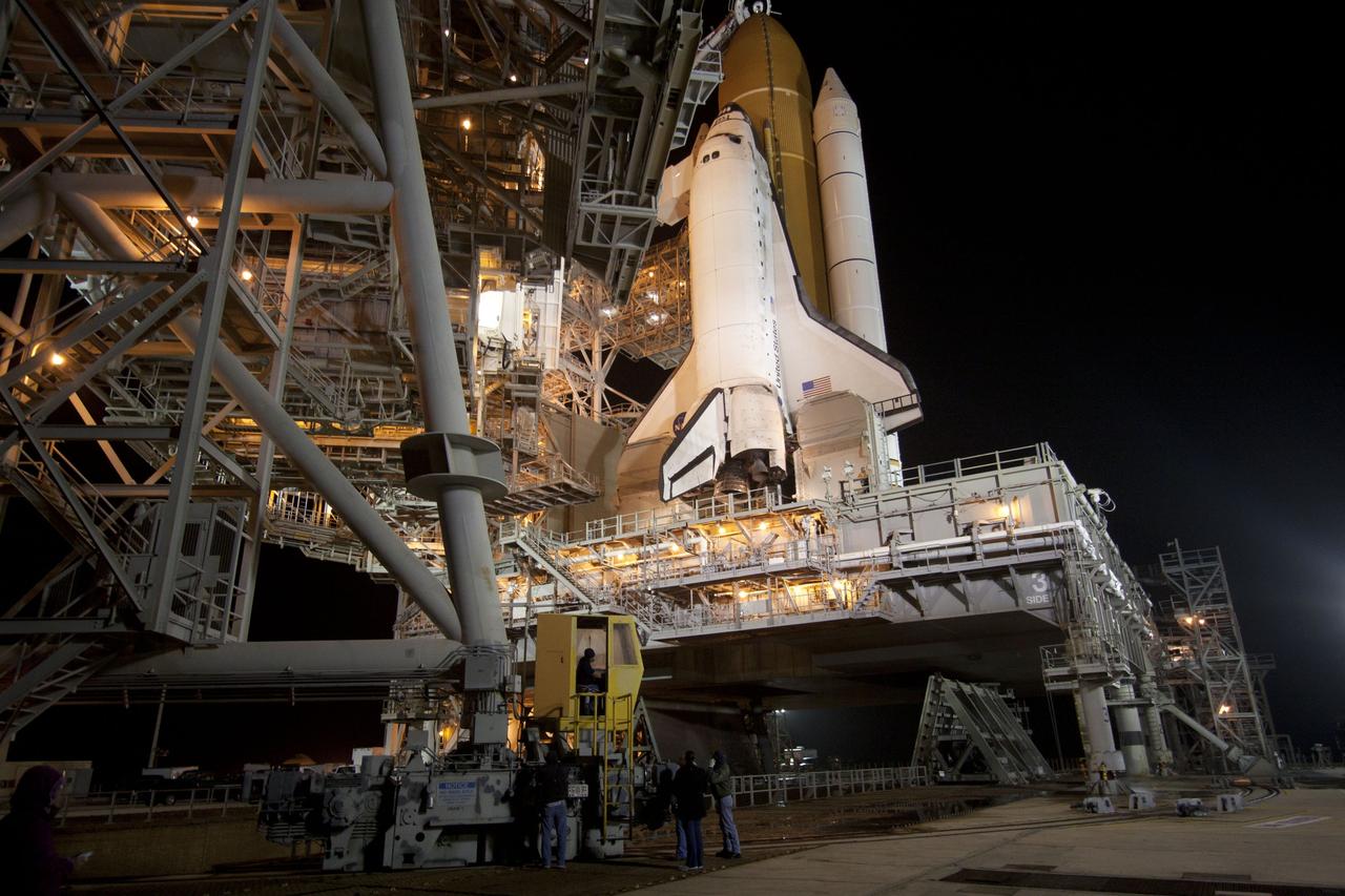 CAPE CANAVERAL, Fla. -- At NASA's Kennedy Space Center in Florida, the rotating service structure on Launch Pad 39A begins to move away from space shuttle Discovery, which is illuminated by bright xenon lights. The structure provides weather protection and access to the shuttle while it awaits lift off on the pad. RSS "rollback," as it's called, began at 8:02 p.m. EST on Feb. 23 and wrapped up at 8:37 p.m. Scheduled to lift off Feb. 24 at 4:50 p.m. EST, Discovery and its six-member crew will deliver the Permanent Multipurpose Module, packed with supplies and critical spare parts, as well as Robonaut 2, the dexterous humanoid astronaut helper, to the International Space Station. Discovery, which will fly its 39th mission, is scheduled to be retired following STS-133. This will be the 133rd Space Shuttle Program mission and the 35th shuttle voyage to the space station. For more information on the STS-133 mission, visit www.nasa.gov/mission_pages/shuttle/shuttlemissions/sts133/. Photo credit: NASA/Jack Pfaller
