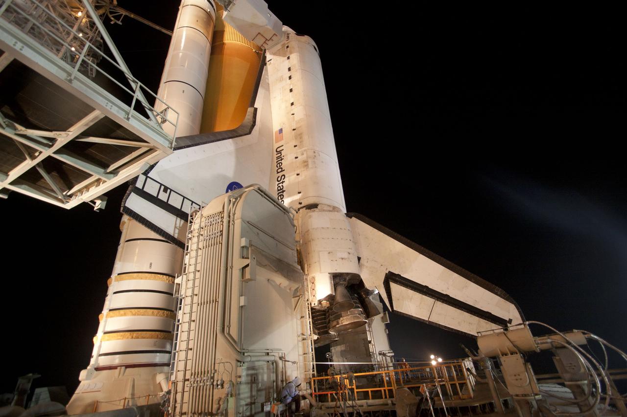 CAPE CANAVERAL, Fla. -- At NASA's Kennedy Space Center in Florida, the rotating service structure on Launch Pad 39A begins to move away from space shuttle Discovery, which is illuminated by bright xenon lights. The structure provides weather protection and access to the shuttle while it awaits lift off on the pad. RSS "rollback," as it's called, began at 8:02 p.m. EST on Feb. 23 and wrapped up at 8:37 p.m. Scheduled to lift off Feb. 24 at 4:50 p.m. EST, Discovery and its six-member crew will deliver the Permanent Multipurpose Module, packed with supplies and critical spare parts, as well as Robonaut 2, the dexterous humanoid astronaut helper, to the International Space Station. Discovery, which will fly its 39th mission, is scheduled to be retired following STS-133. This will be the 133rd Space Shuttle Program mission and the 35th shuttle voyage to the space station. For more information on the STS-133 mission, visit www.nasa.gov/mission_pages/shuttle/shuttlemissions/sts133/. Photo credit: NASA/Jack Pfaller