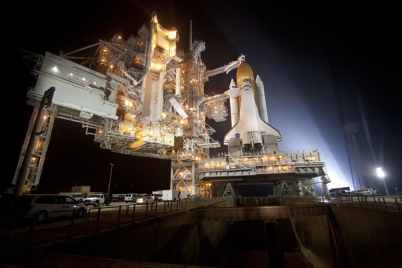 CAPE CANAVERAL, Fla. -- At NASA's Kennedy Space Center in Florida, space shuttle Discovery is illuminated by bright xenon lights on Launch Pad 39A after the rotating service structure was moved away. The structure provides weather protection and access to the shuttle while it awaits lift off on the pad. RSS "rollback," as it's called, began at 8:02 p.m. EST on Feb. 23 and wrapped up at 8:37 p.m. Scheduled to lift off Feb. 24 at 4:50 p.m. EST, Discovery and its six-member crew will deliver the Permanent Multipurpose Module, packed with supplies and critical spare parts, as well as Robonaut 2, the dexterous humanoid astronaut helper, to the International Space Station. Discovery, which will fly its 39th mission, is scheduled to be retired following STS-133. This will be the 133rd Space Shuttle Program mission and the 35th shuttle voyage to the space station. For more information on the STS-133 mission, visit www.nasa.gov/mission_pages/shuttle/shuttlemissions/sts133/. Photo credit: NASA/Jack Pfaller