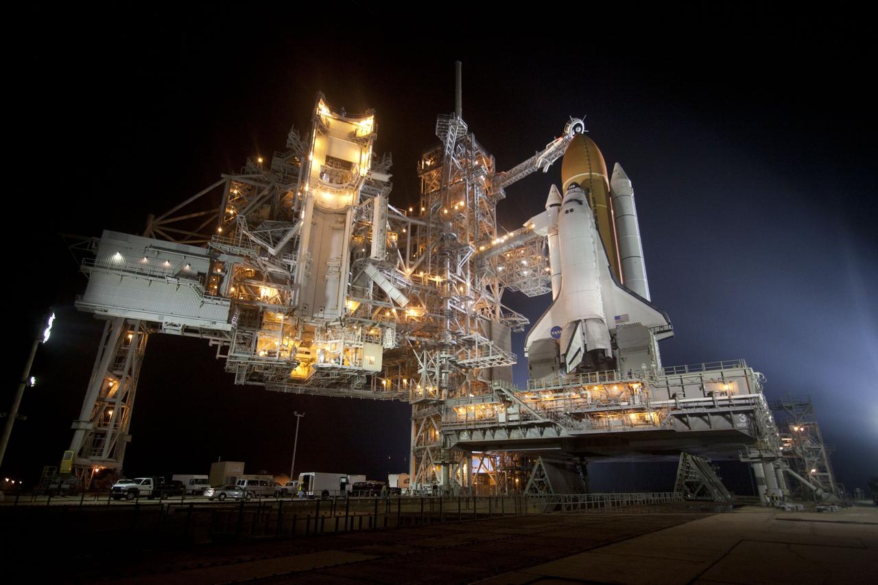 CAPE CANAVERAL, Fla. -- At NASA's Kennedy Space Center in Florida, space shuttle Discovery is illuminated by bright xenon lights on Launch Pad 39A after the rotating service structure was moved away. The structure provides weather protection and access to the shuttle while it awaits lift off on the pad. RSS "rollback," as it's called, began at 8:02 p.m. EST on Feb. 23 and wrapped up at 8:37 p.m. Scheduled to lift off Feb. 24 at 4:50 p.m. EST, Discovery and its six-member crew will deliver the Permanent Multipurpose Module, packed with supplies and critical spare parts, as well as Robonaut 2, the dexterous humanoid astronaut helper, to the International Space Station. Discovery, which will fly its 39th mission, is scheduled to be retired following STS-133. This will be the 133rd Space Shuttle Program mission and the 35th shuttle voyage to the space station. For more information on the STS-133 mission, visit www.nasa.gov/mission_pages/shuttle/shuttlemissions/sts133/. Photo credit: NASA/Jack Pfaller