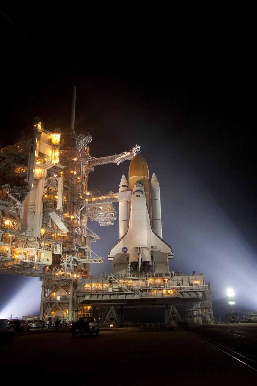 CAPE CANAVERAL, Fla. -- At NASA's Kennedy Space Center in Florida, space shuttle Discovery is illuminated by bright xenon lights on Launch Pad 39A after the rotating service structure was moved away. The structure provides weather protection and access to the shuttle while it awaits lift off on the pad. RSS "rollback," as it's called, began at 8:02 p.m. EST on Feb. 23 and wrapped up at 8:37 p.m. Scheduled to lift off Feb. 24 at 4:50 p.m. EST, Discovery and its six-member crew will deliver the Permanent Multipurpose Module, packed with supplies and critical spare parts, as well as Robonaut 2, the dexterous humanoid astronaut helper, to the International Space Station. Discovery, which will fly its 39th mission, is scheduled to be retired following STS-133. This will be the 133rd Space Shuttle Program mission and the 35th shuttle voyage to the space station. For more information on the STS-133 mission, visit www.nasa.gov/mission_pages/shuttle/shuttlemissions/sts133/. Photo credit: NASA/Jack Pfaller