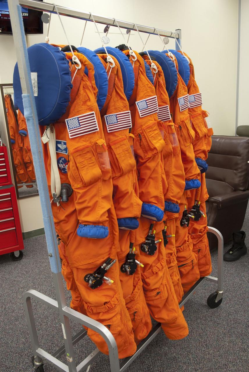 CAPE CANAVERAL, Fla. -- Inside the Operations and Checkout Building (O&C) at NASA's Kennedy Space Center in Florida, six bright-orange, launch-and-entry suits are ready to be worn by the STS-133 astronauts during their climb into orbit aboard space shuttle Discovery. Scheduled to lift off Feb. 24 at 4:50 p.m. EST, Discovery and its crew will deliver the Permanent Multipurpose Module, packed with supplies and critical spare parts, as well as Robonaut 2, the dexterous humanoid astronaut helper, to the International Space Station. Discovery, which will fly its 39th mission, is scheduled to be retired following STS-133. This will be the 133rd Space Shuttle Program mission and the 35th shuttle voyage to the space station. For more information on the STS-133 mission, visit www.nasa.gov/mission_pages/shuttle/shuttlemissions/sts133/. Photo credit: NASA/Jim Grossmann